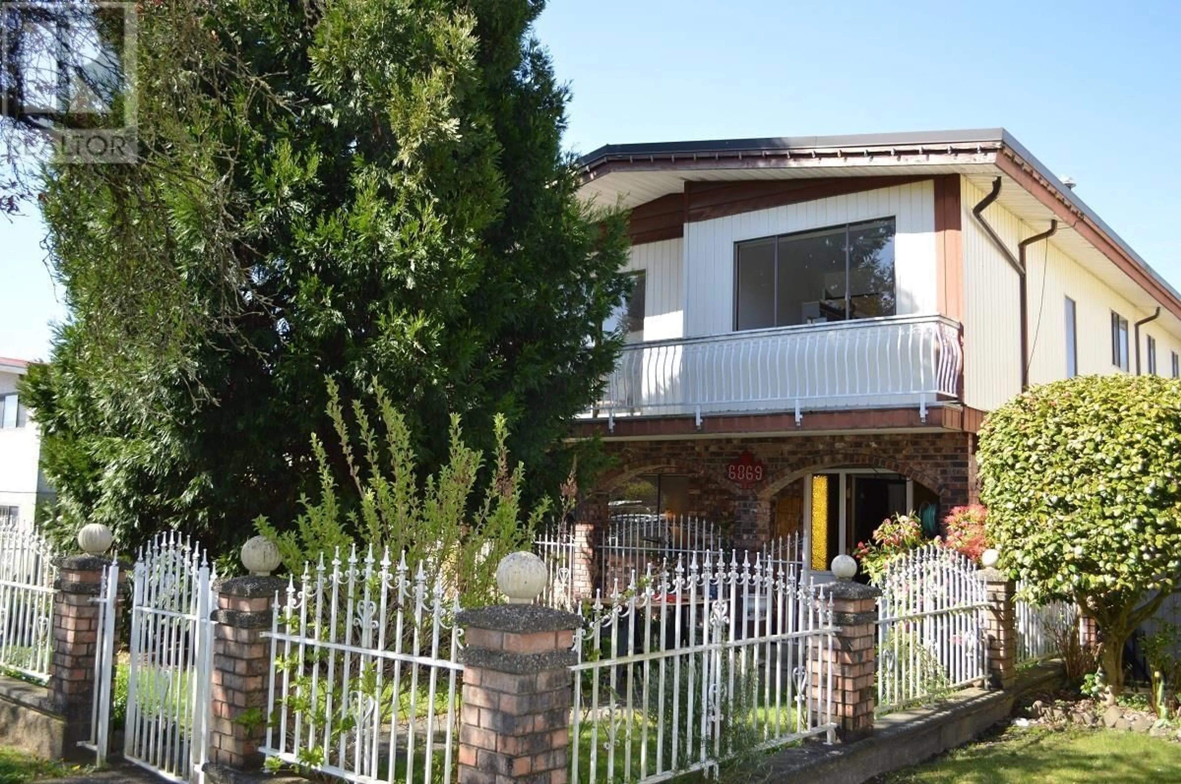 Home with brick exterior material, street for 6869 GLADSTONE STREET, Vancouver British Columbia V5P4G3