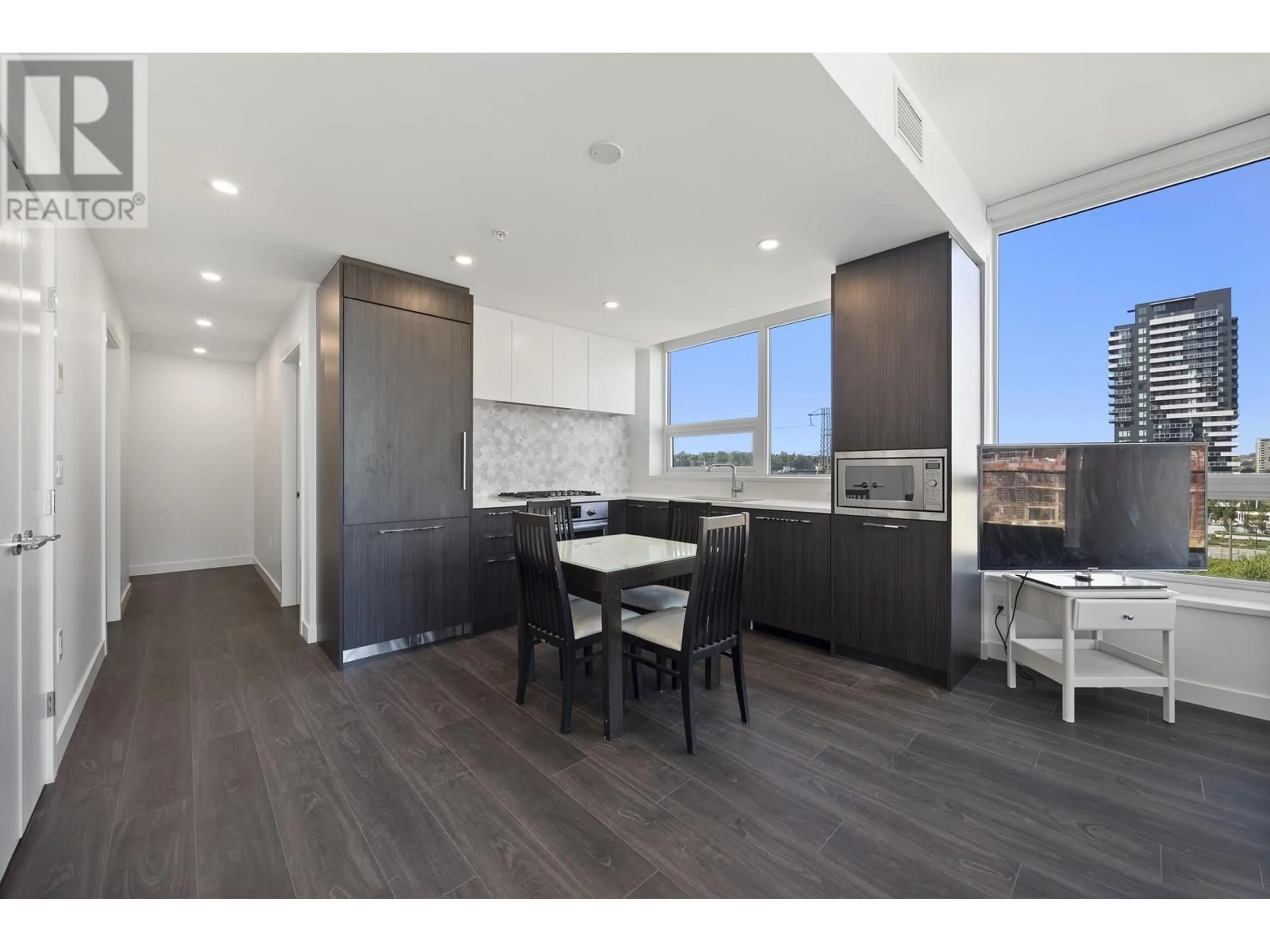 Open concept kitchen, wood/laminate floor for 707 - 2425 ALPHA AVENUE, Burnaby British Columbia V5C0N6