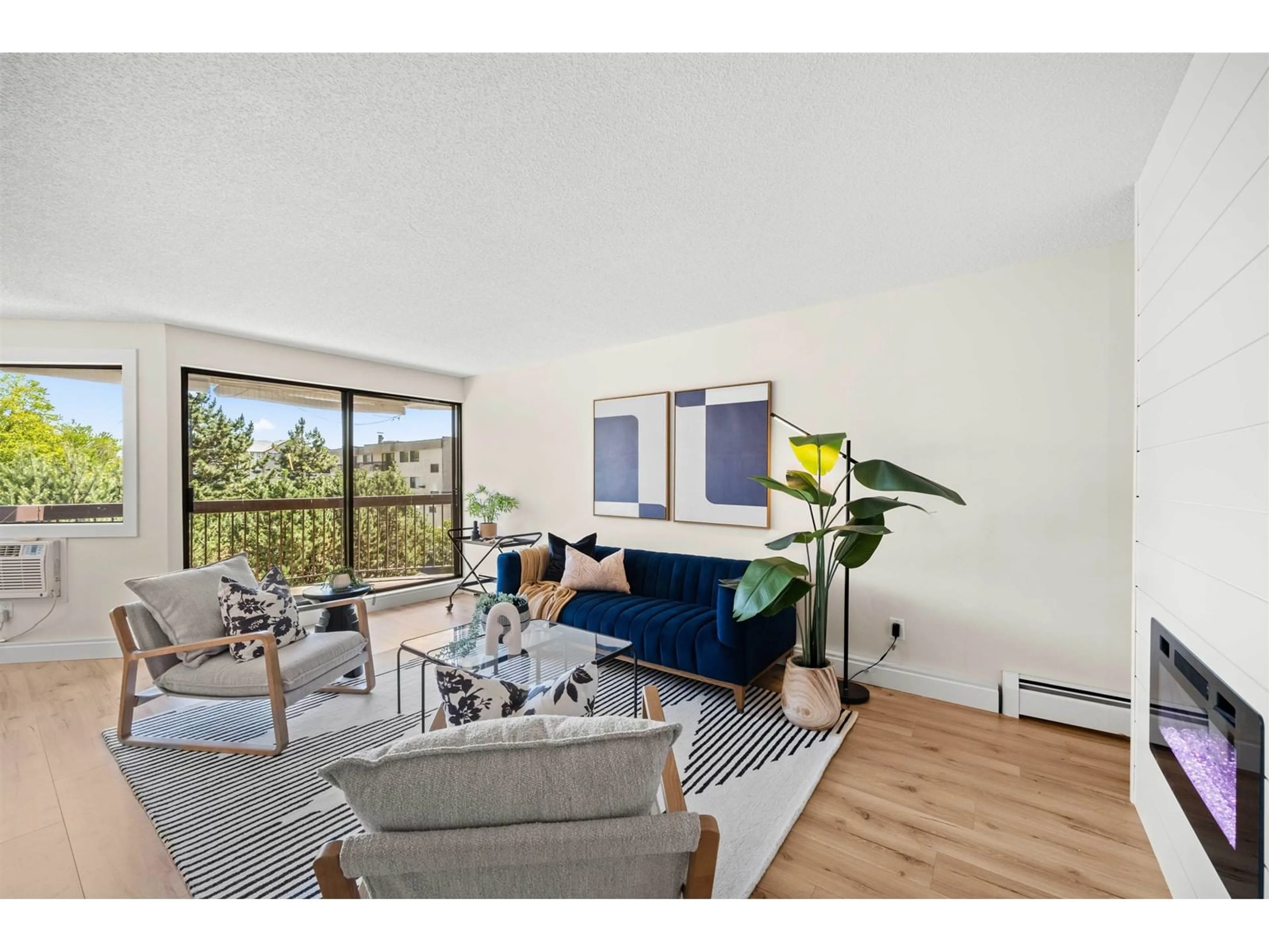 Living room with furniture, wood/laminate floor for 219 - 31955 OLD YALE, Abbotsford British Columbia V2T4N1