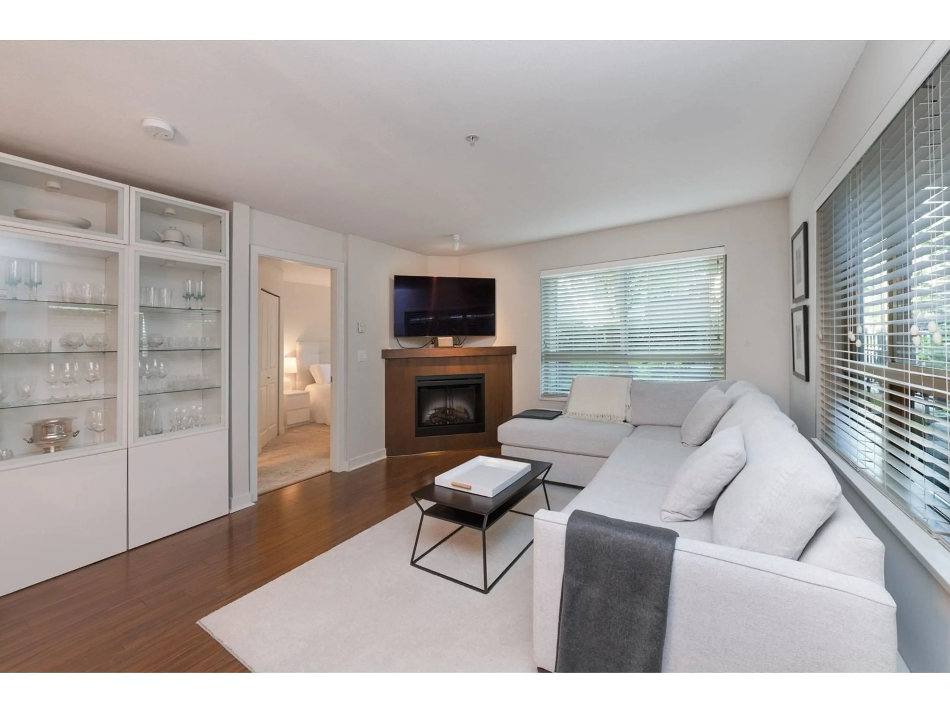 Living room with furniture, wood/laminate floor for C104 - 8929 202, Langley British Columbia V1M0B4