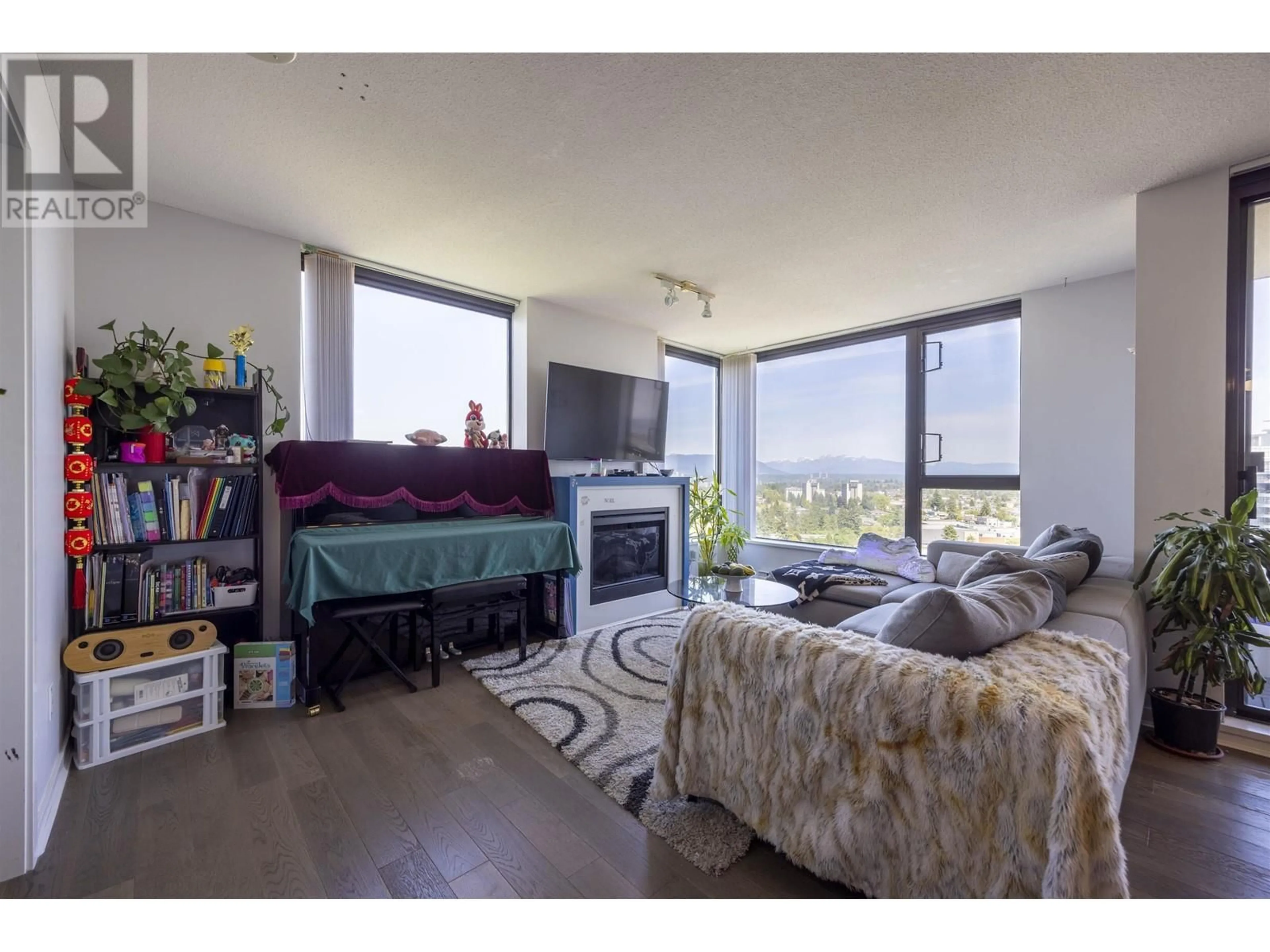 Living room with furniture, wood/laminate floor for 2103 - 7063 HALL AVENUE, Burnaby British Columbia V5E0A5
