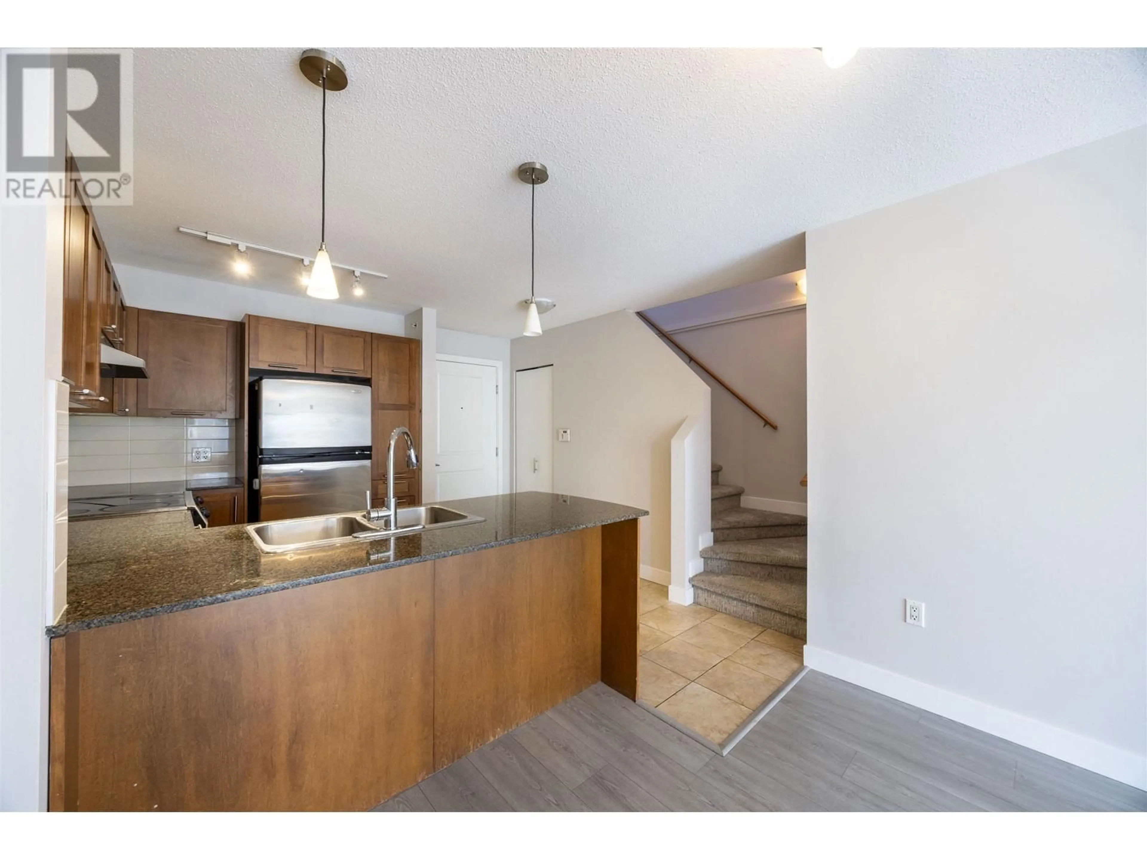 Open concept kitchen, unknown for 416 - 19677 MEADOW GARDENS WAY, Pitt Meadows British Columbia V3Y0A2