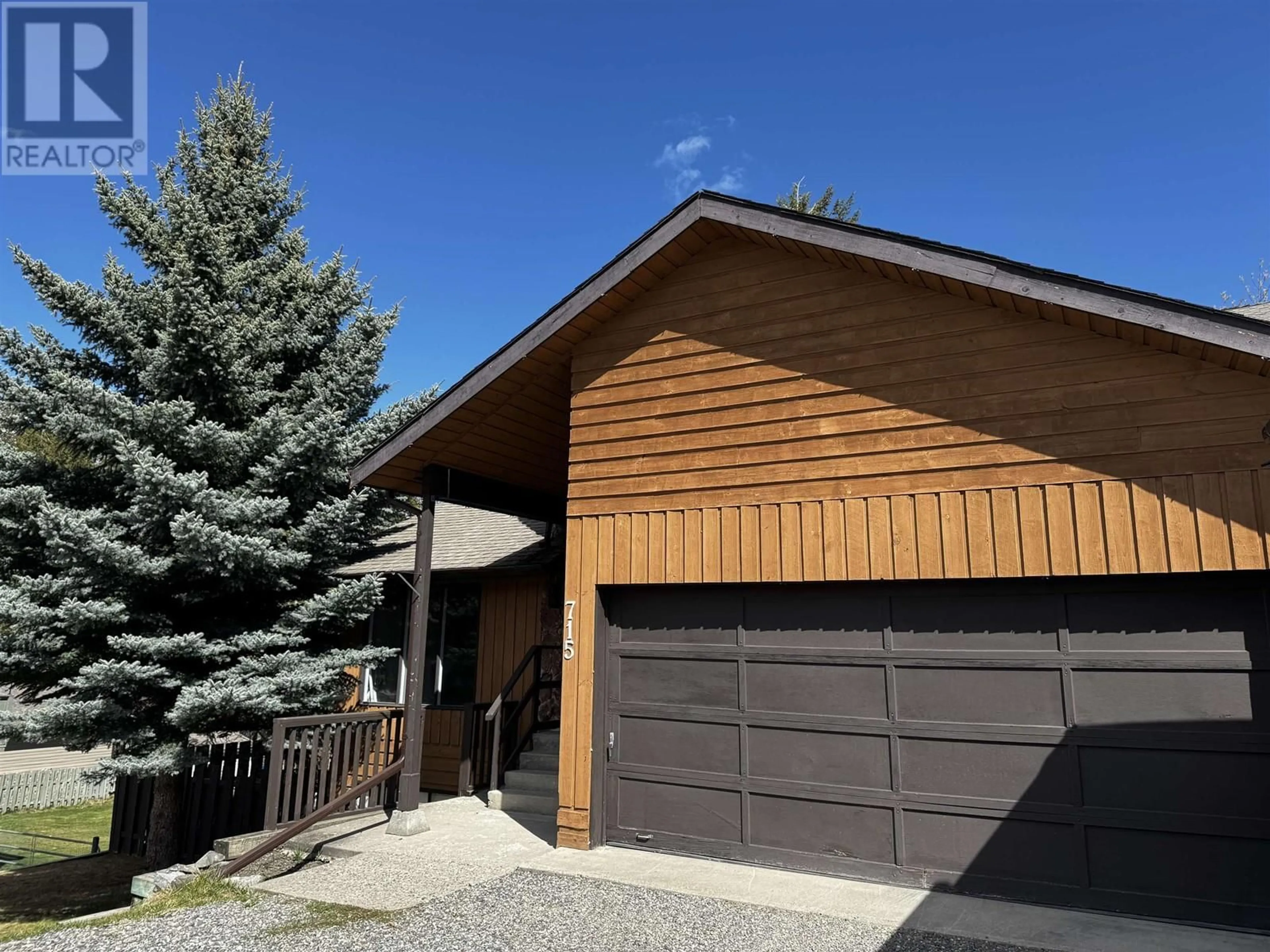 Home with vinyl exterior material, street for 715 BURGHLEY PLACE, 100 Mile House British Columbia V0K2E0