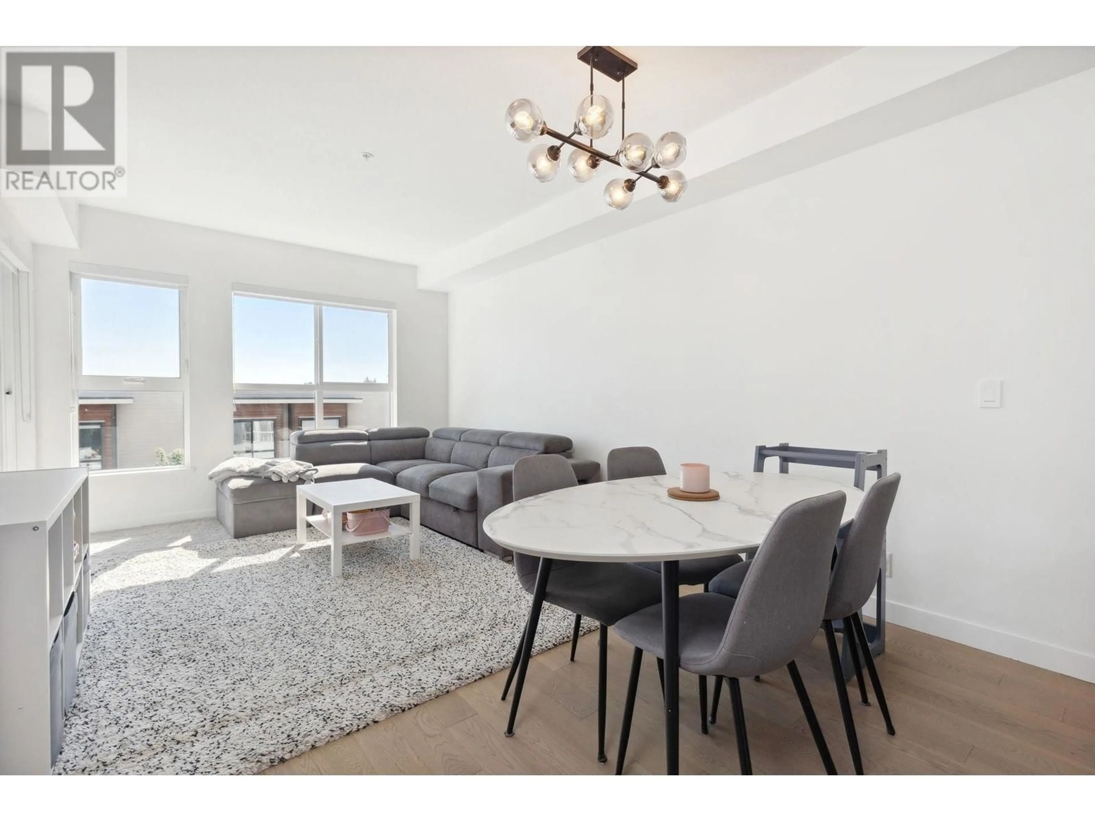 Living room with furniture, wood/laminate floor for 417 - 10177 RIVER DRIVE, Richmond British Columbia V6X0S2