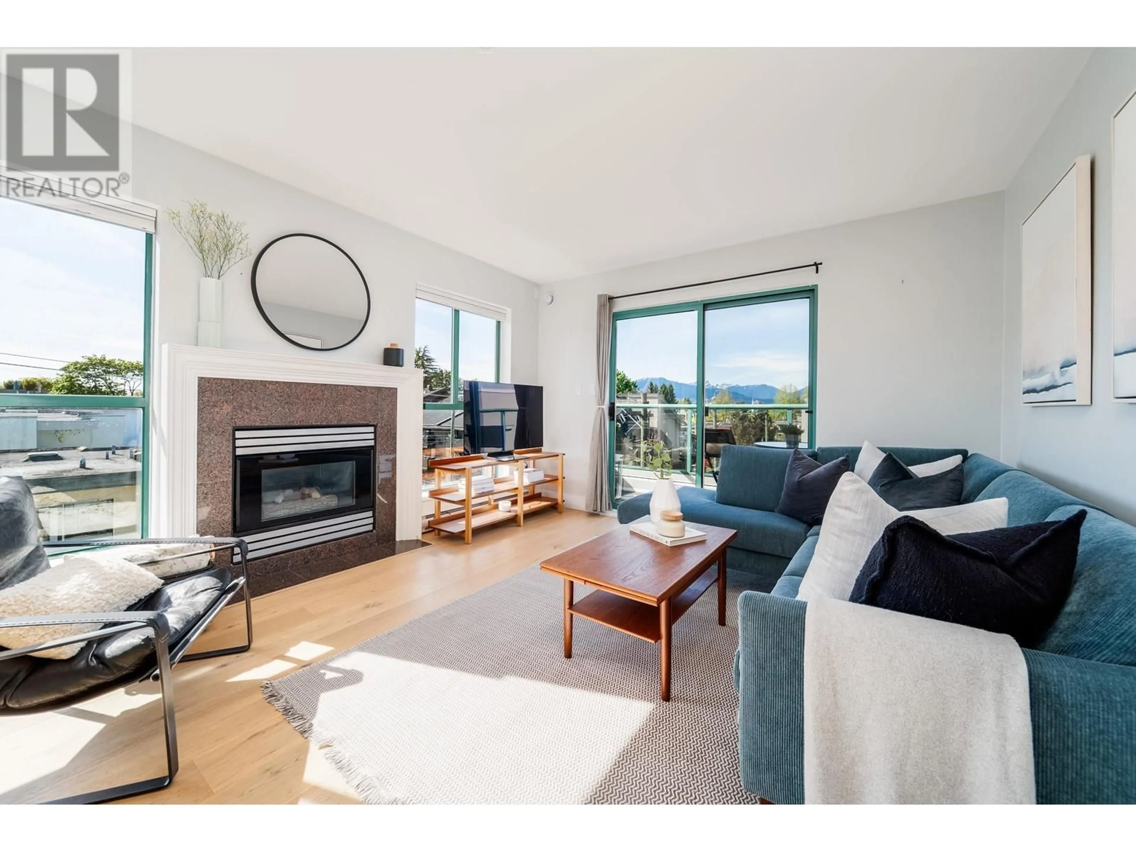Living room with furniture, wood/laminate floor for 314 - 189 16TH AVENUE, Vancouver British Columbia V5T4R2