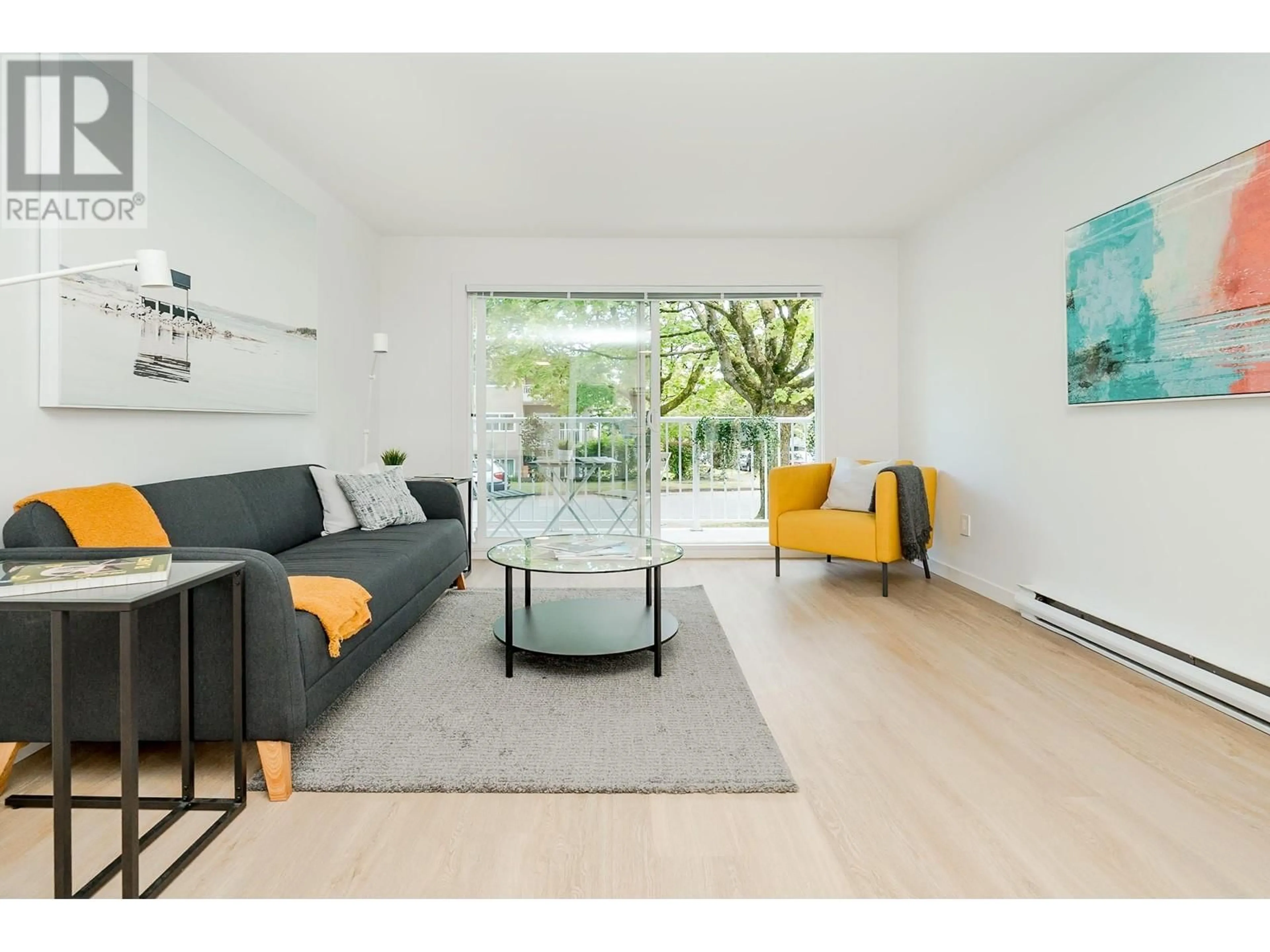 Living room with furniture, wood/laminate floor for 104 - 8690 MONTCALM STREET, Vancouver British Columbia V6P4P8