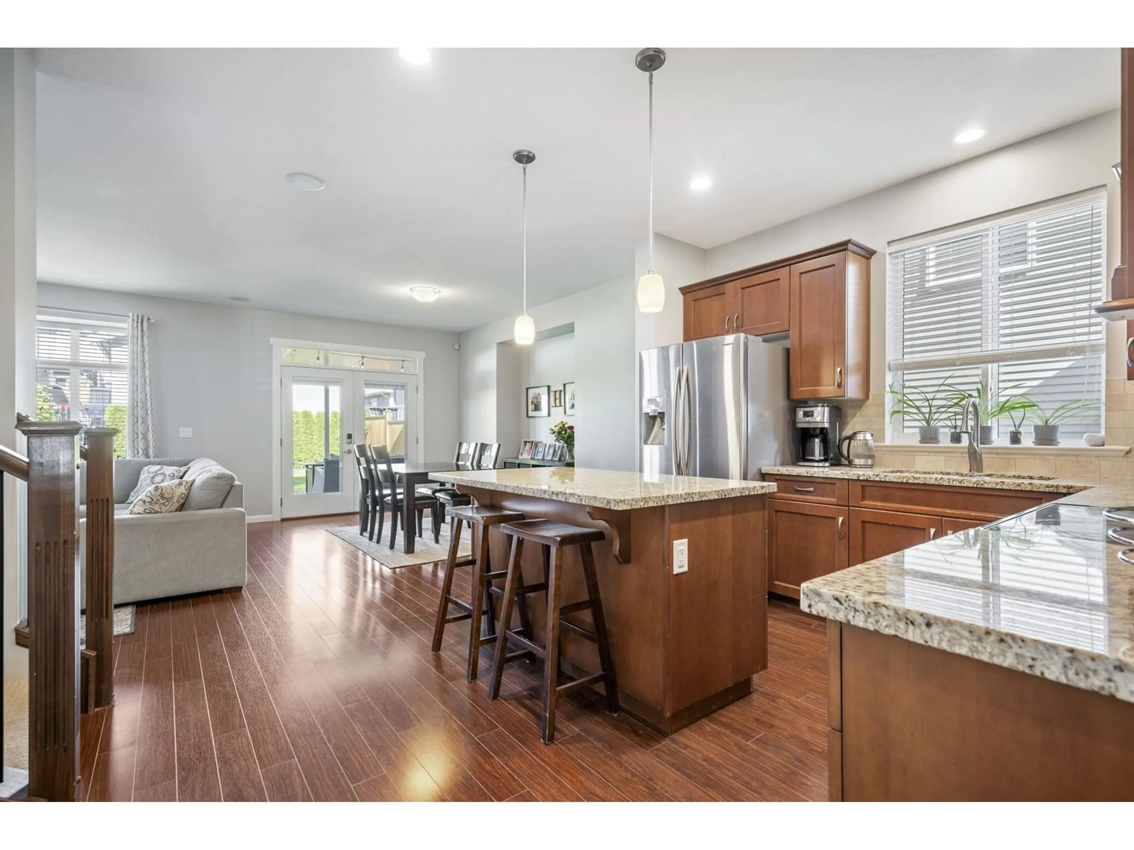 Open concept kitchen, wood/laminate floor for 6867 208A, Langley British Columbia V2Y0G2