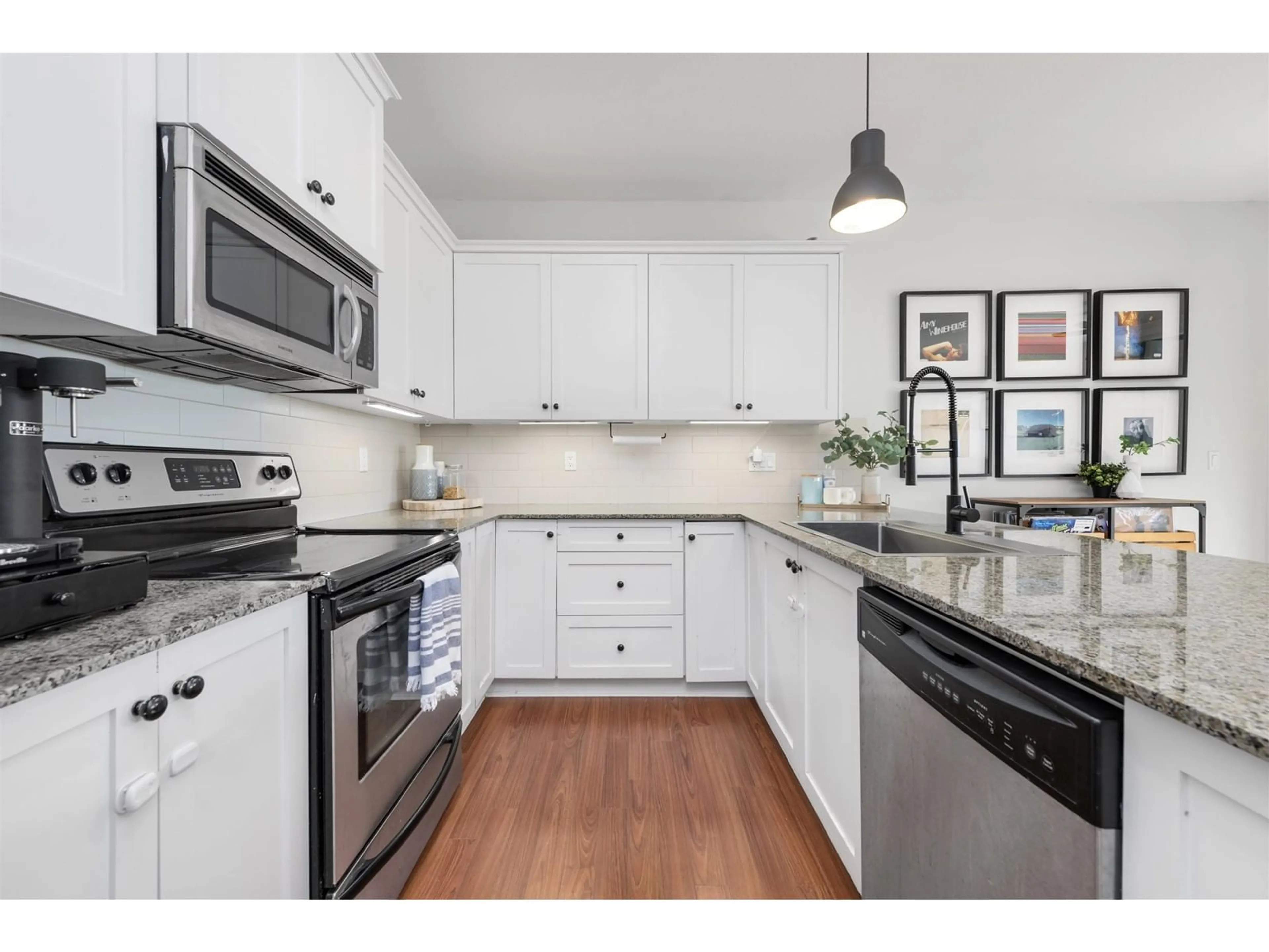 Open concept kitchen, ceramic/tile floor for 408 - 17712 57A, Surrey British Columbia V3S1J1