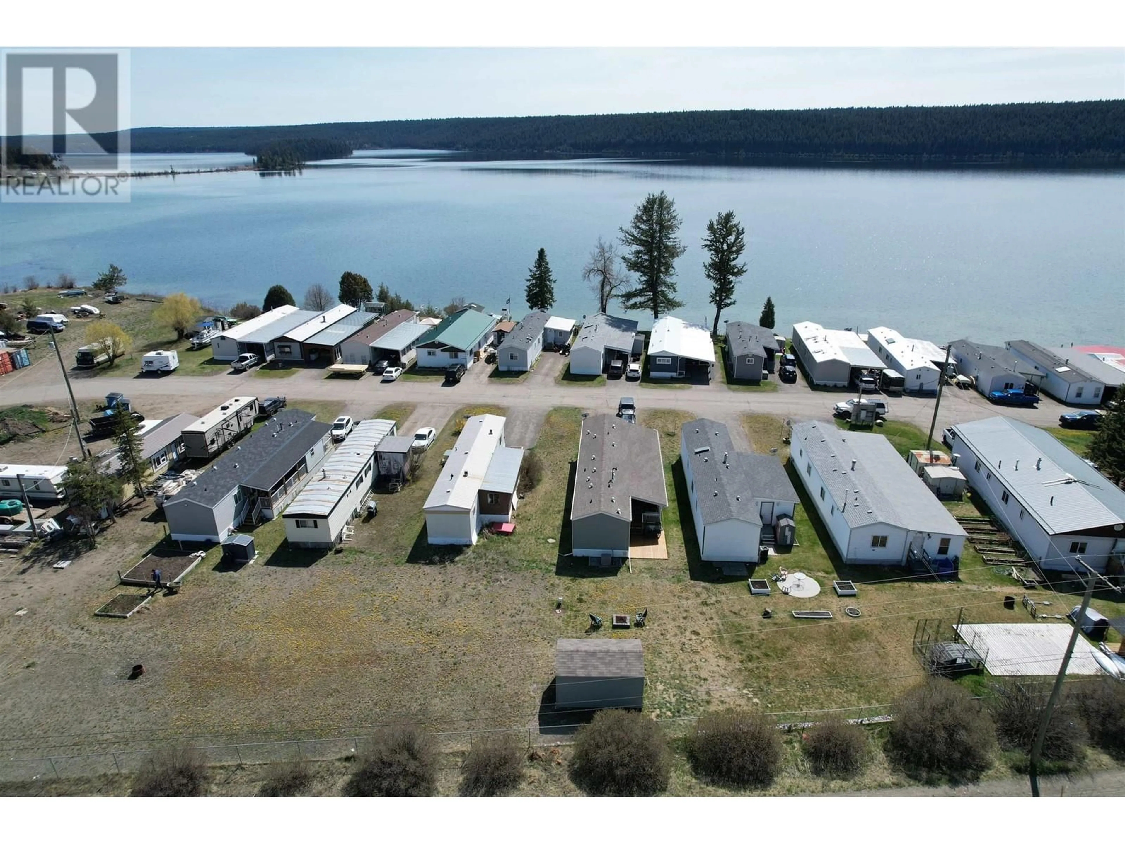 A pic from outside/outdoor area/front of a property/back of a property/a pic from drone, water/lake/river/ocean view for 20 - 3728 97 HIGHWAY, Lac La Hache British Columbia V0K1T0