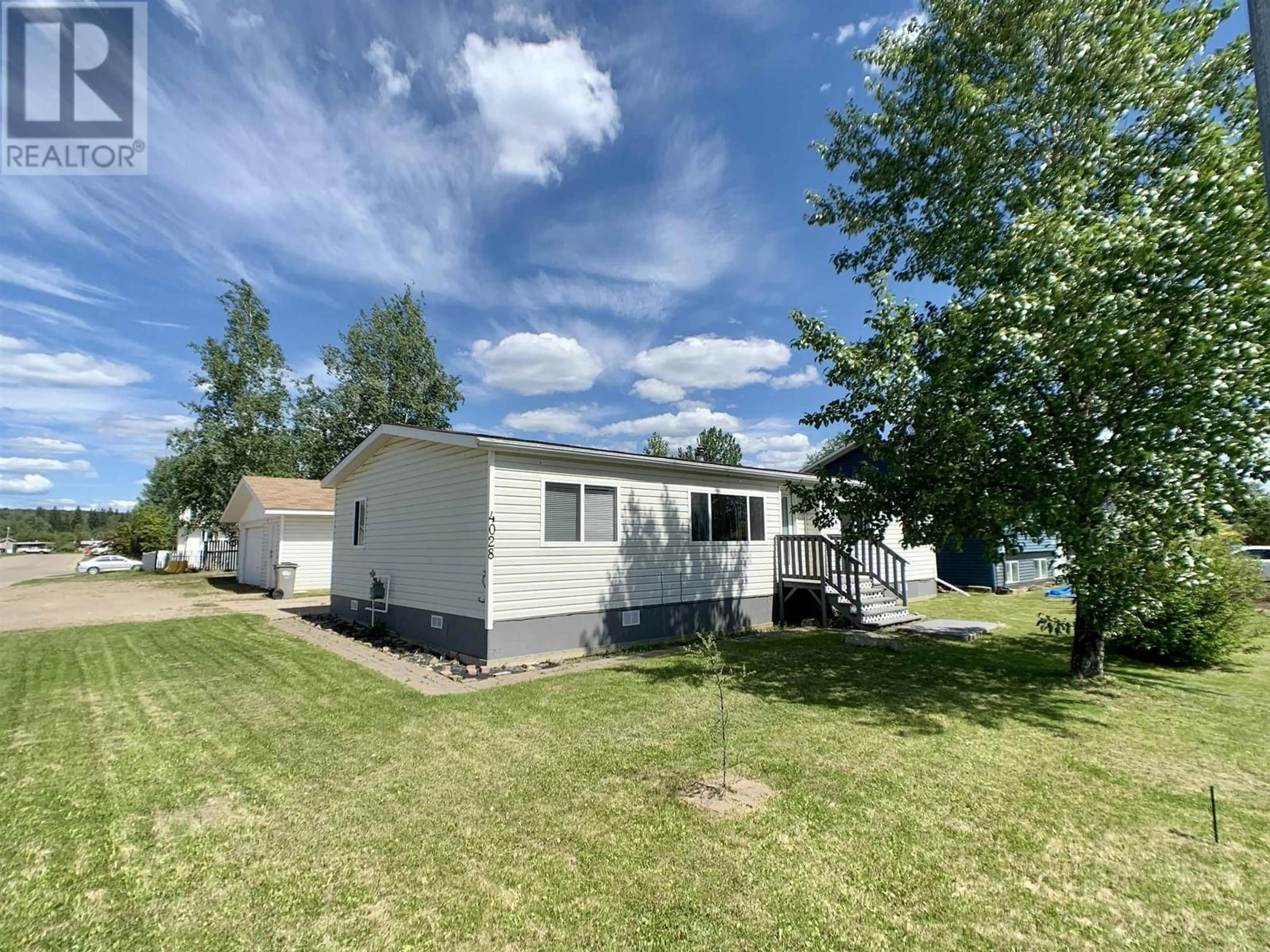 A pic from outside/outdoor area/front of a property/back of a property/a pic from drone, water/lake/river/ocean view for 4028 POPLAR AVENUE, Fort Nelson British Columbia V0C1R0