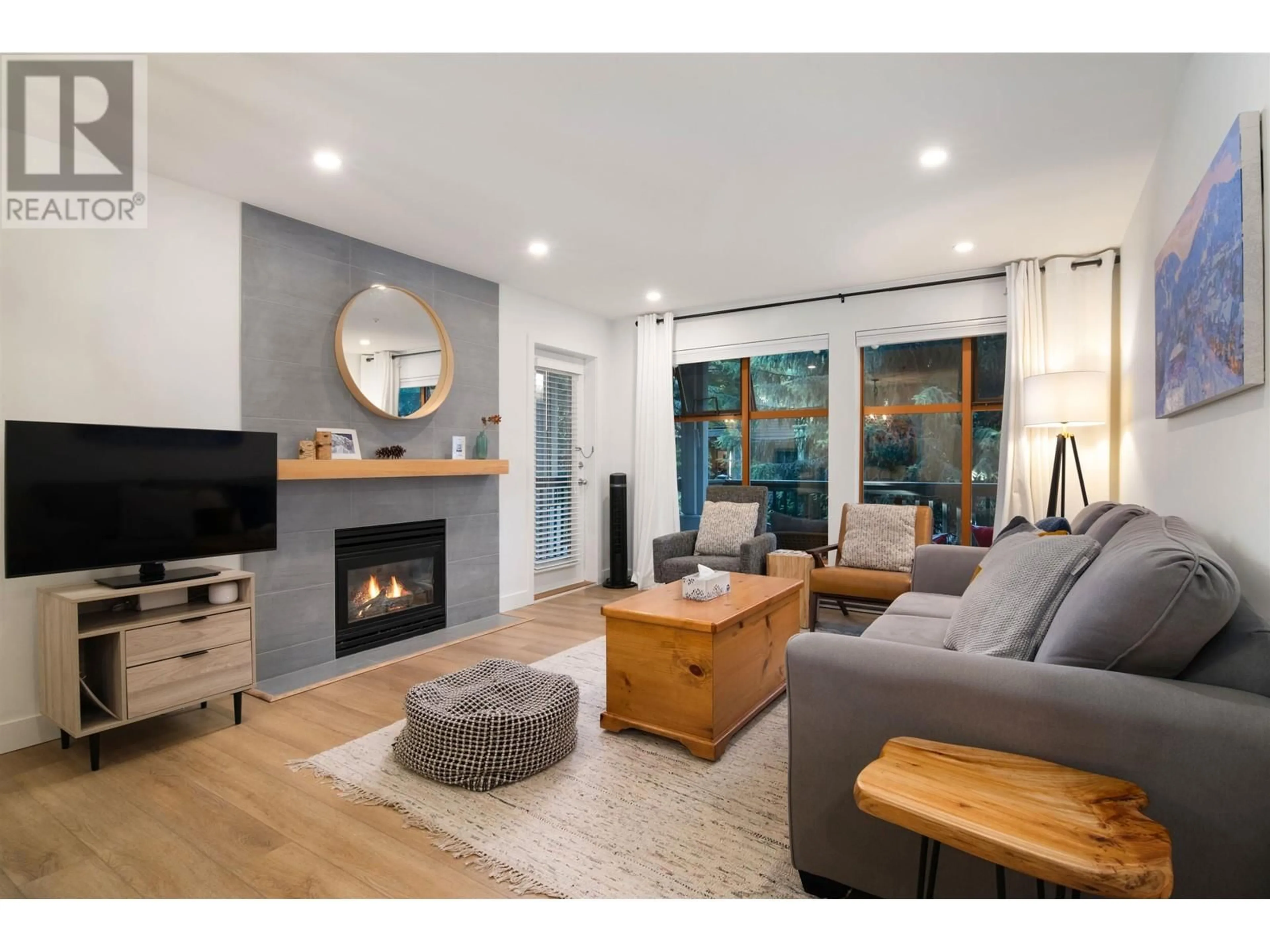 Living room with furniture, wood/laminate floor for 109 - 4355 NORTHLANDS BOULEVARD, Whistler British Columbia V8E1C3