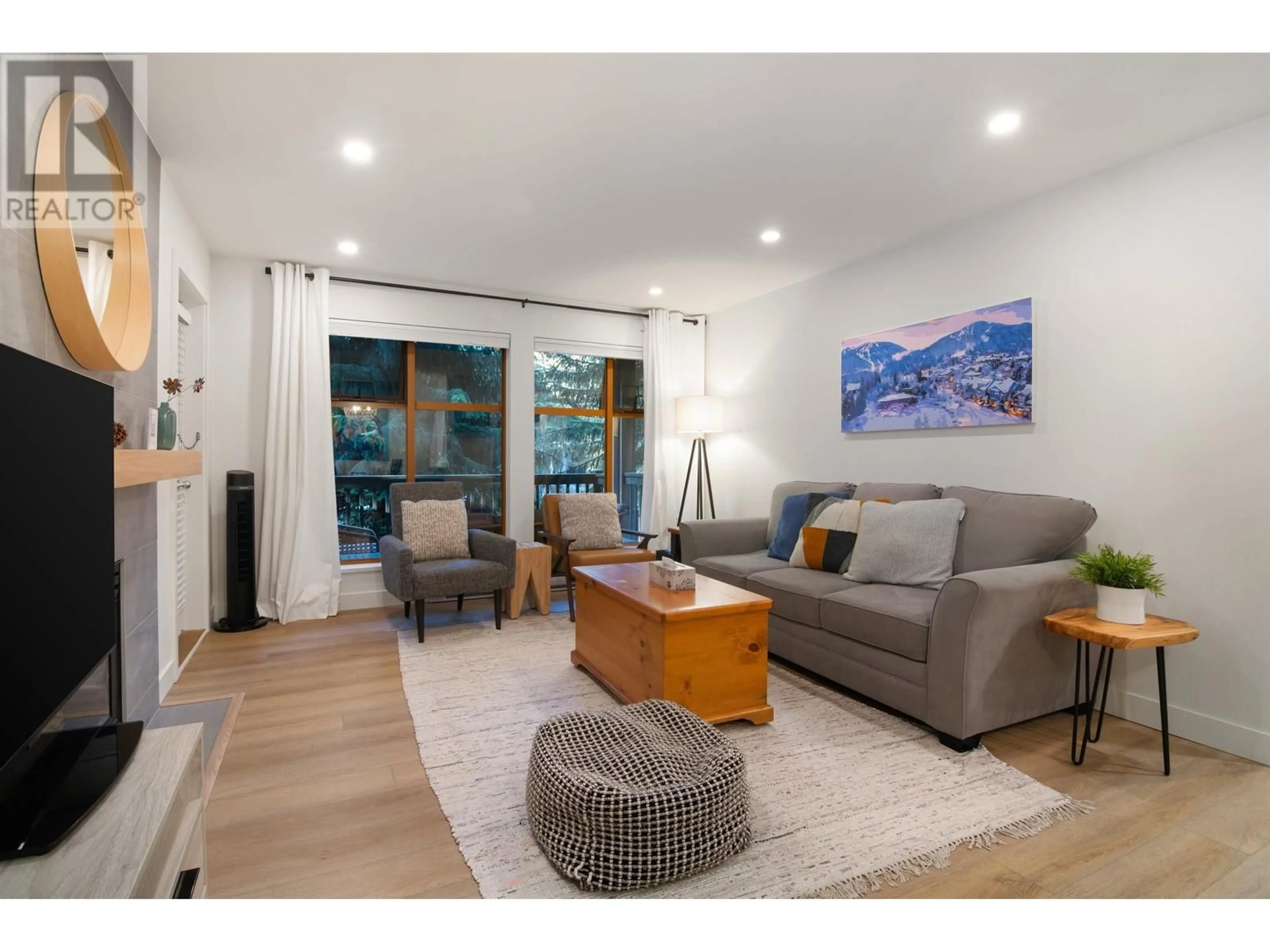 Living room with furniture, wood/laminate floor for 109 - 4355 NORTHLANDS BOULEVARD, Whistler British Columbia V8E1C3