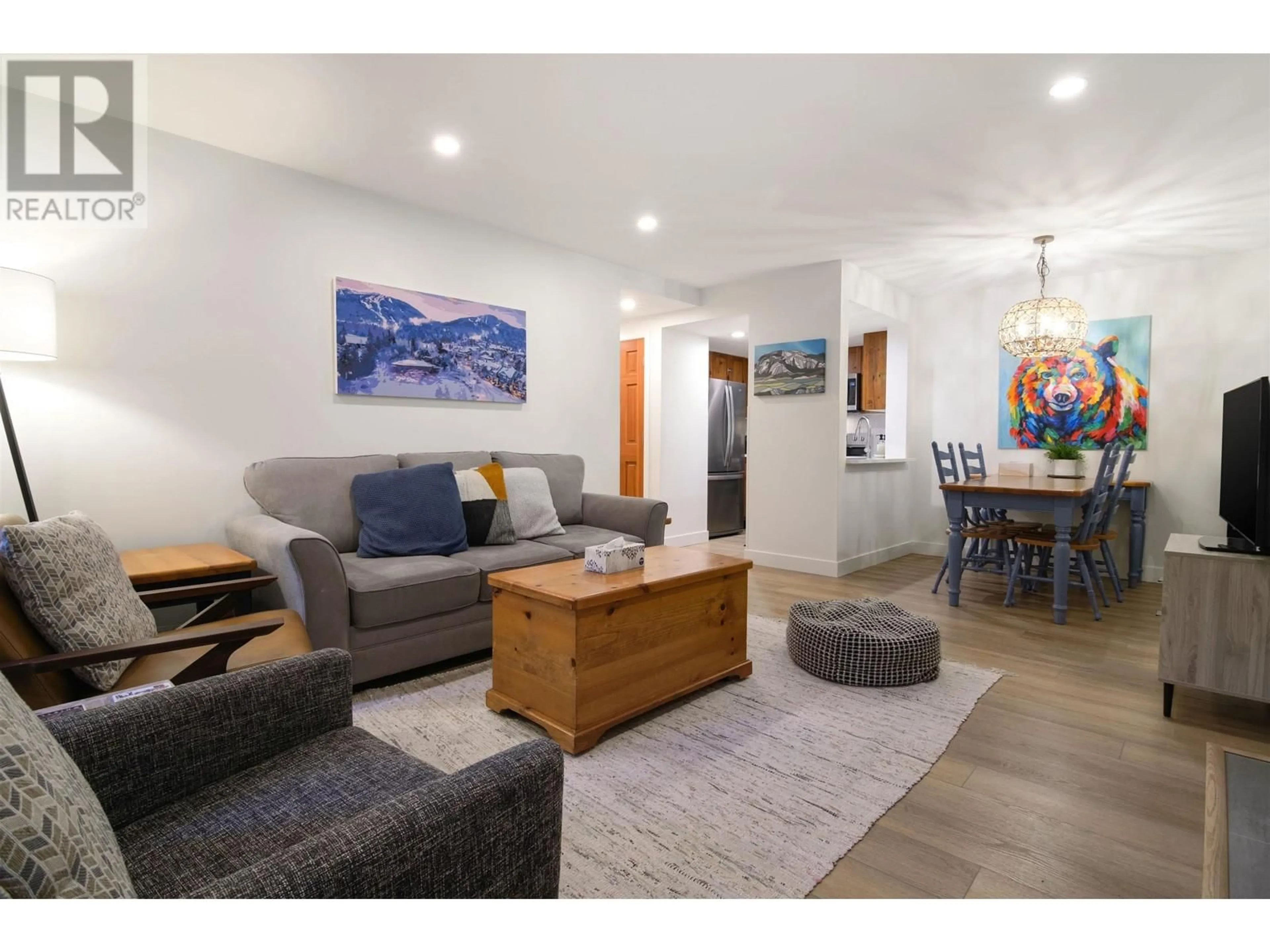 Living room with furniture, wood/laminate floor for 109 - 4355 NORTHLANDS BOULEVARD, Whistler British Columbia V8E1C3