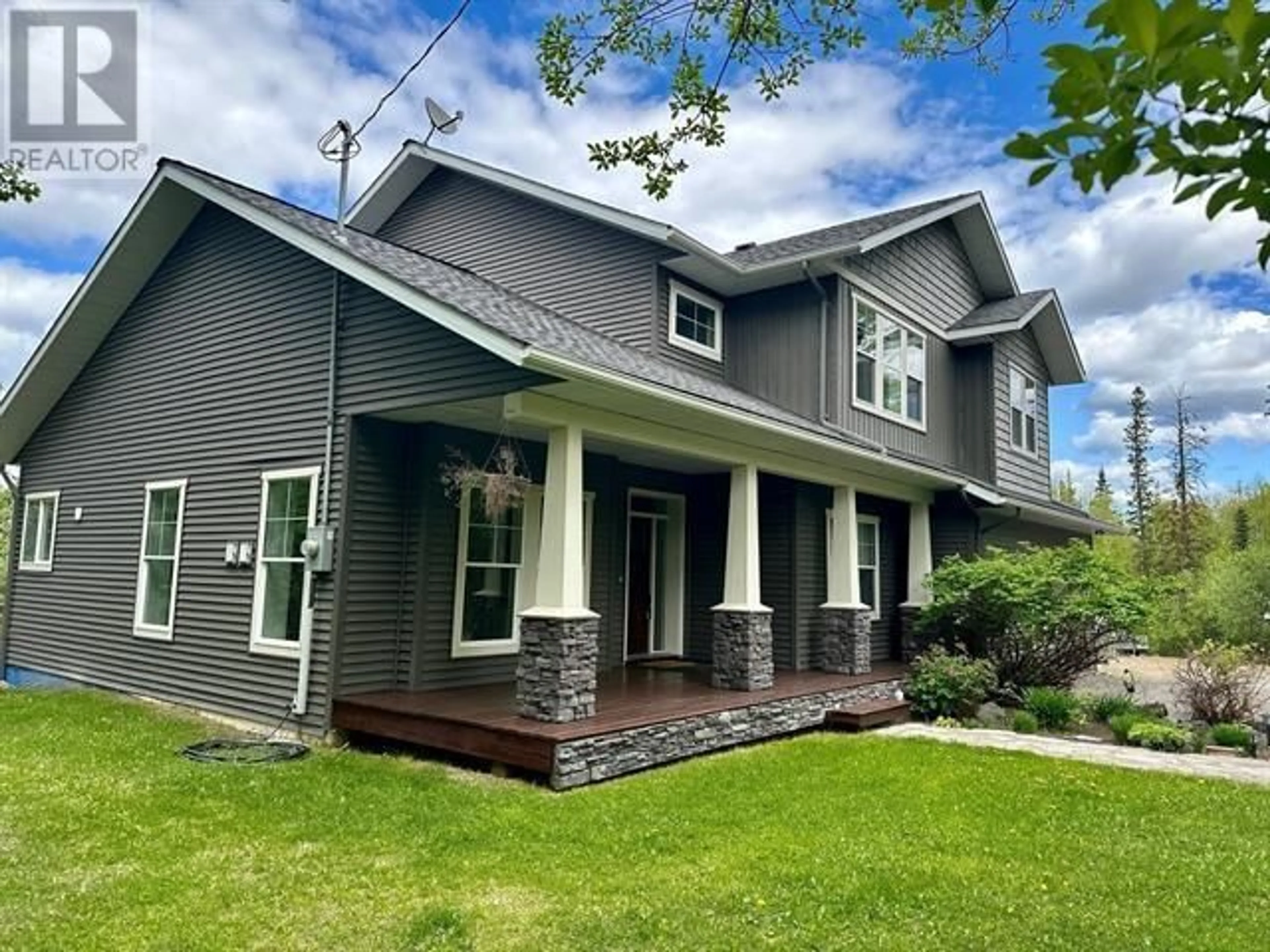 Home with vinyl exterior material, street for 1787 16 HIGHWAY, Vanderhoof British Columbia V0J3A0