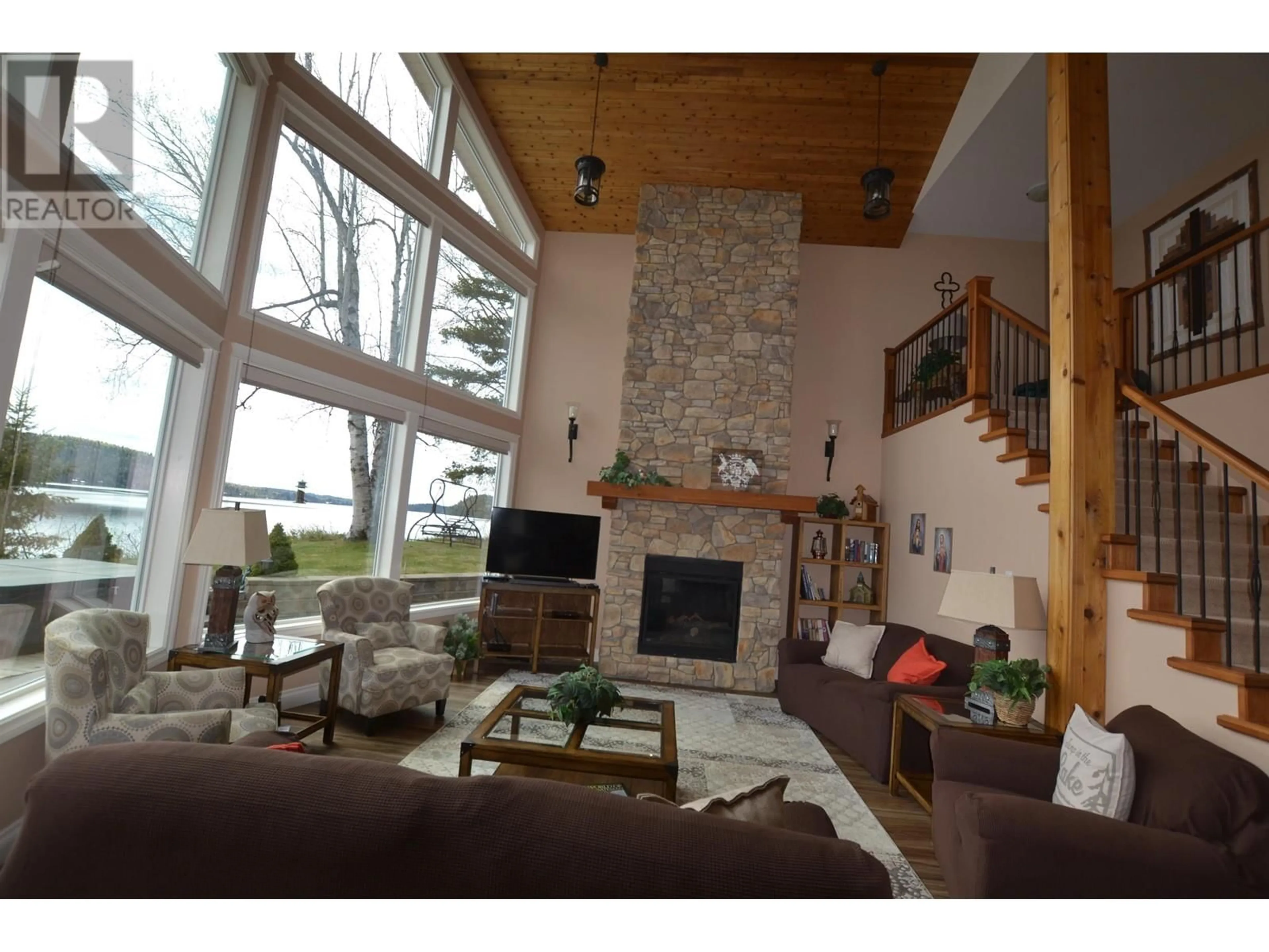 Living room with furniture, wood/laminate floor for 4011 HAGGENS POINT ROAD, Horsefly British Columbia V0L1L0