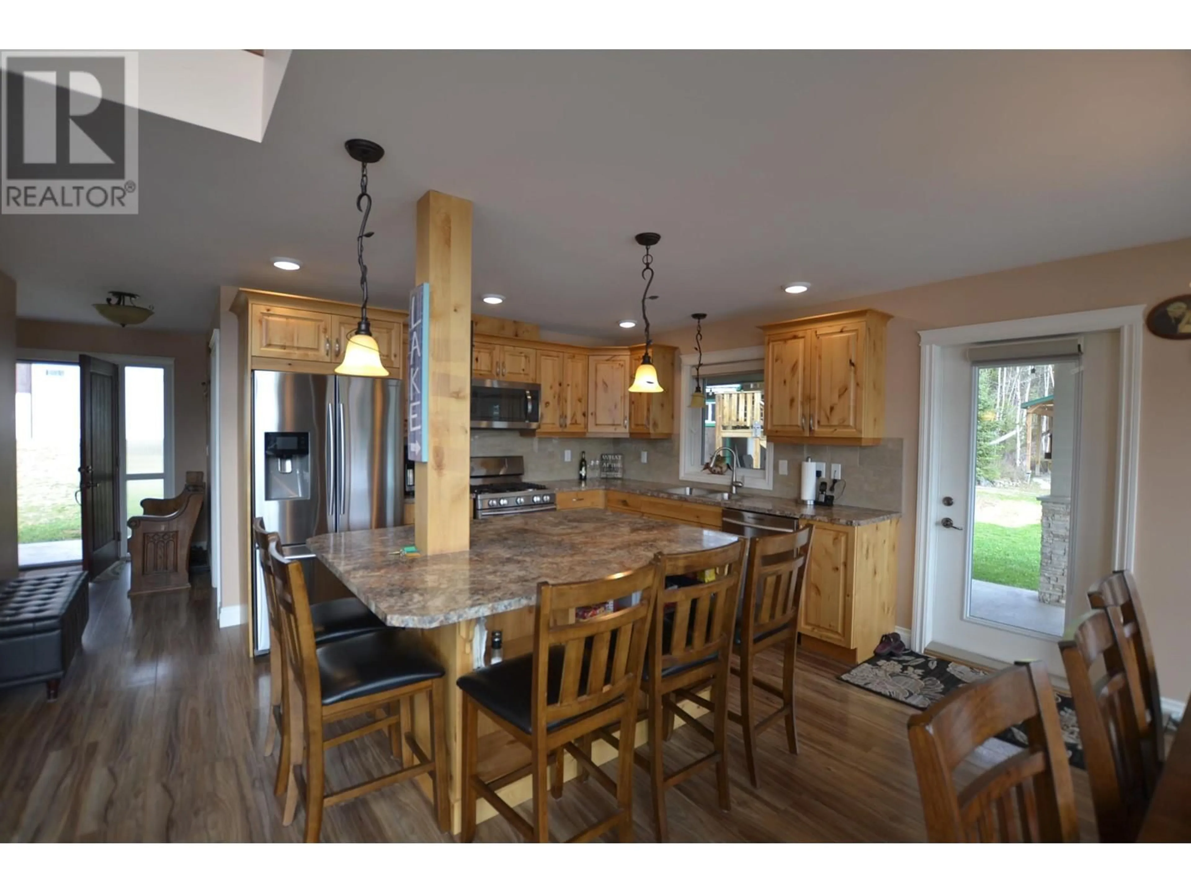 Open concept kitchen, wood/laminate floor for 4011 HAGGENS POINT ROAD, Horsefly British Columbia V0L1L0