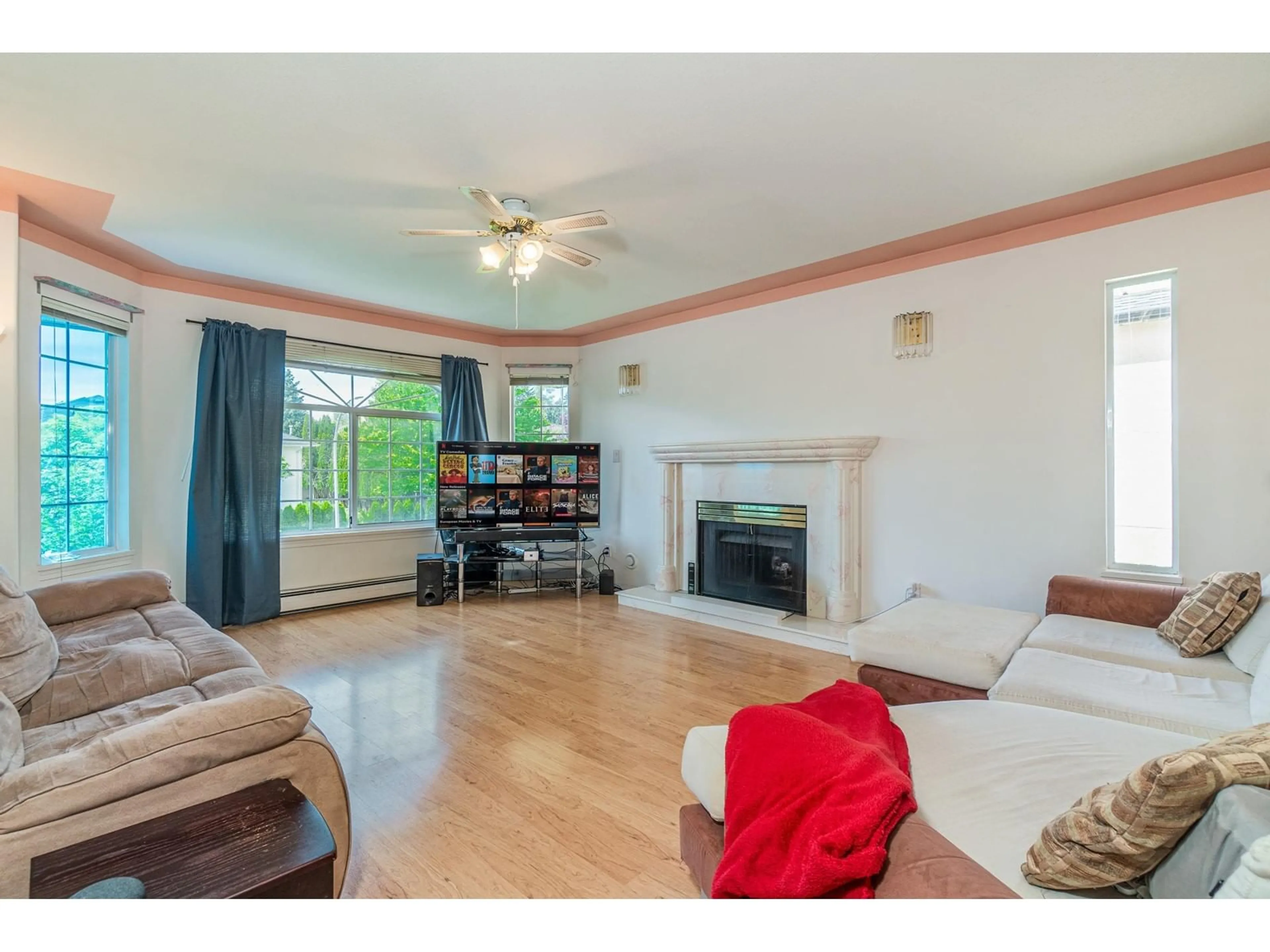 Living room with furniture, wood/laminate floor for 8058 163A, Surrey British Columbia V4N0J6