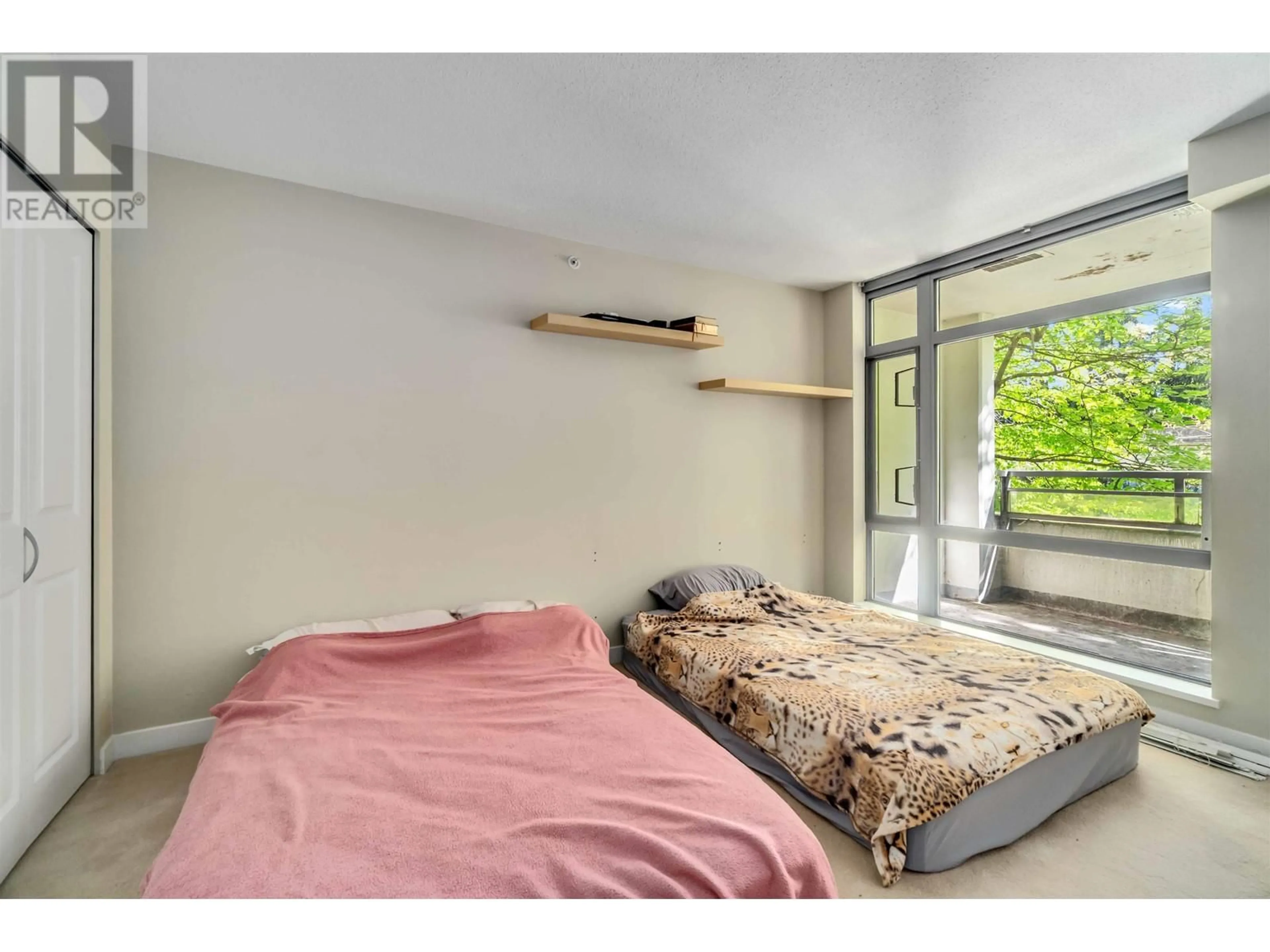 Bedroom with bed, unknown for 307 - 3660 VANNESS AVENUE, Vancouver British Columbia V5R6H8