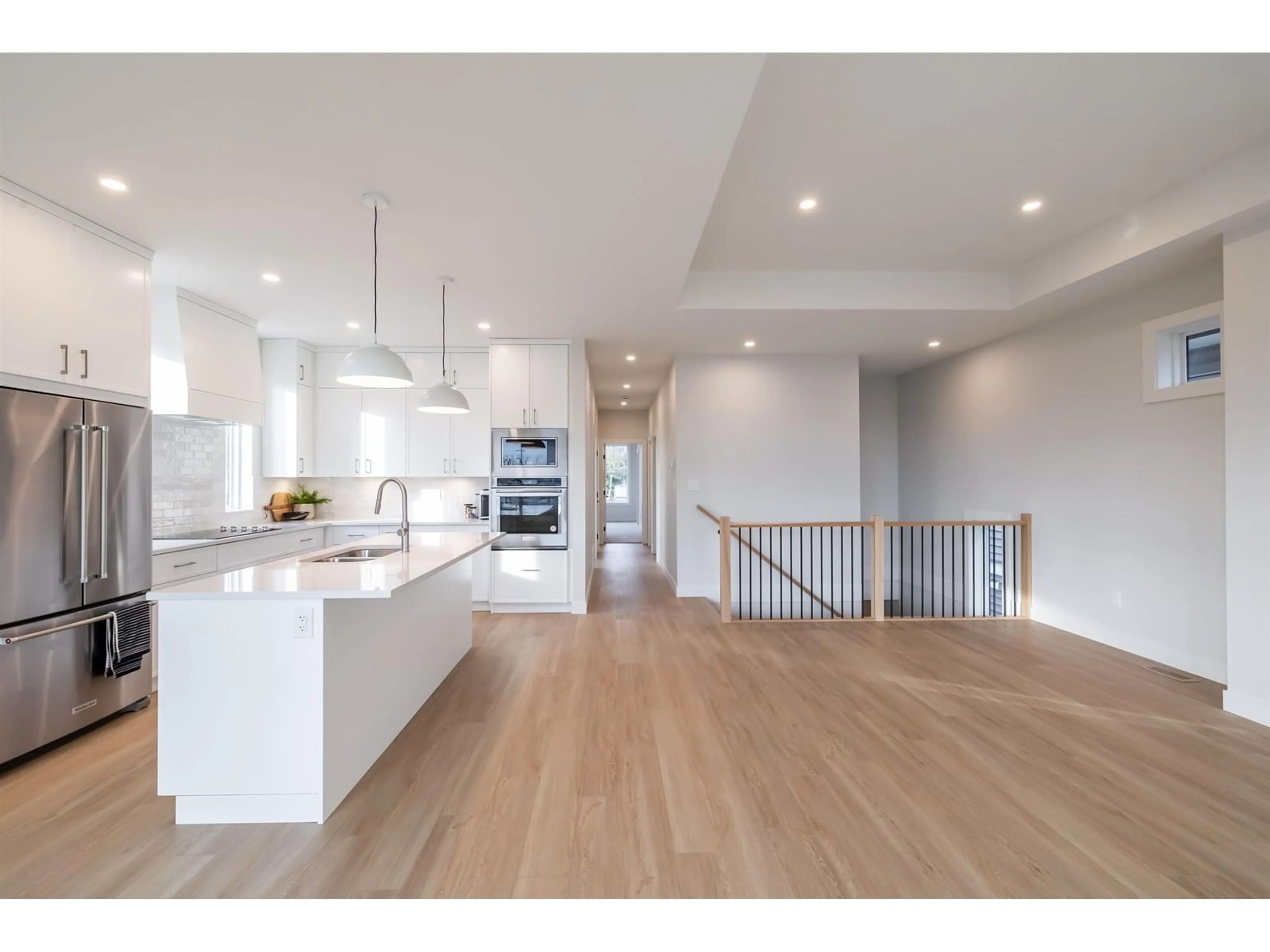 Open concept kitchen, wood/laminate floor for 9382 MCNAUGHT ROAD, Chilliwack British Columbia V2P6E8