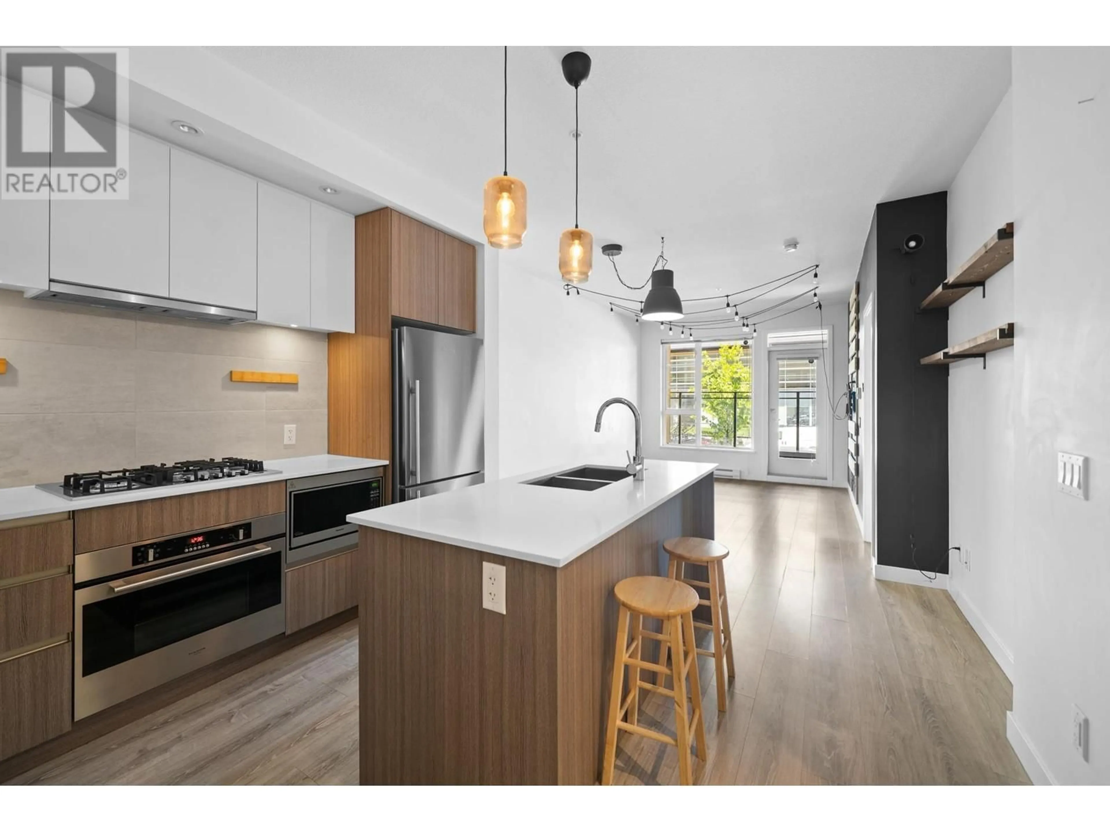 Open concept kitchen, wood/laminate floor for 214 - 516 FOSTER AVENUE, Coquitlam British Columbia V3J0H8