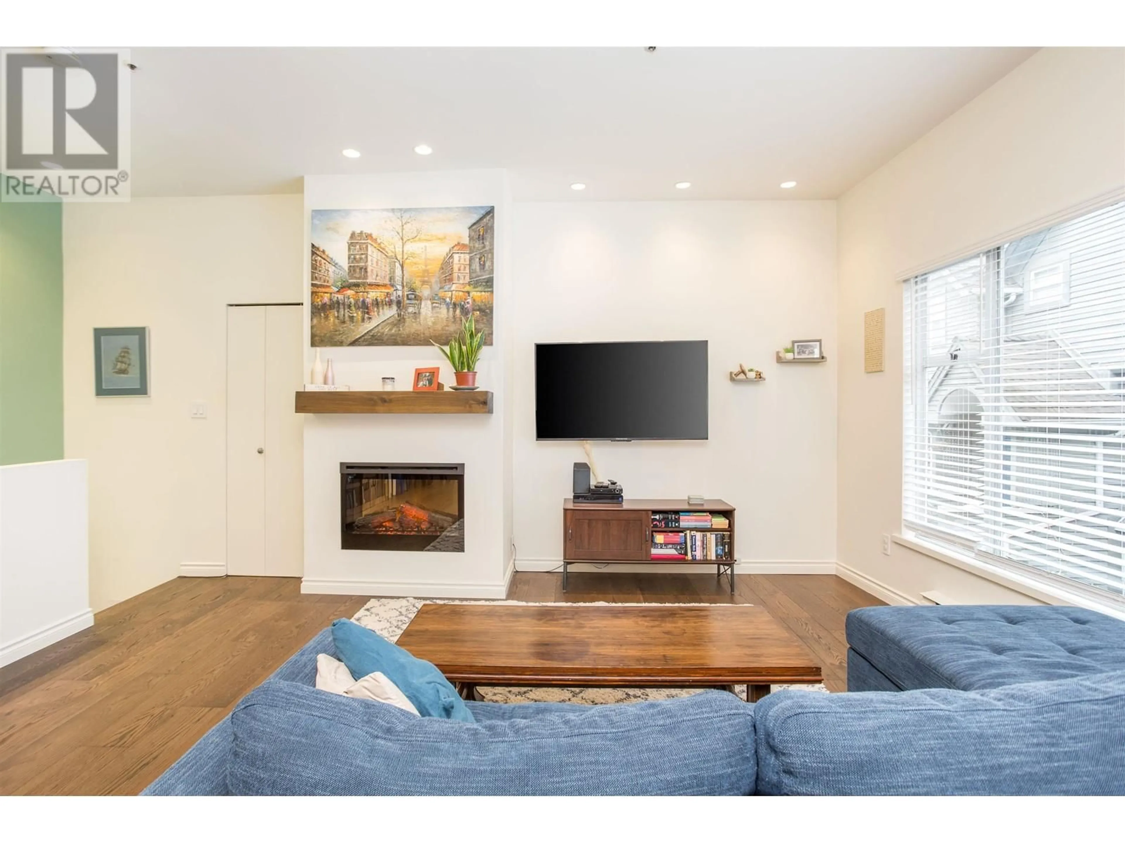 Living room with furniture, wood/laminate floor for 819 7TH AVENUE, Vancouver British Columbia V5Z1C2