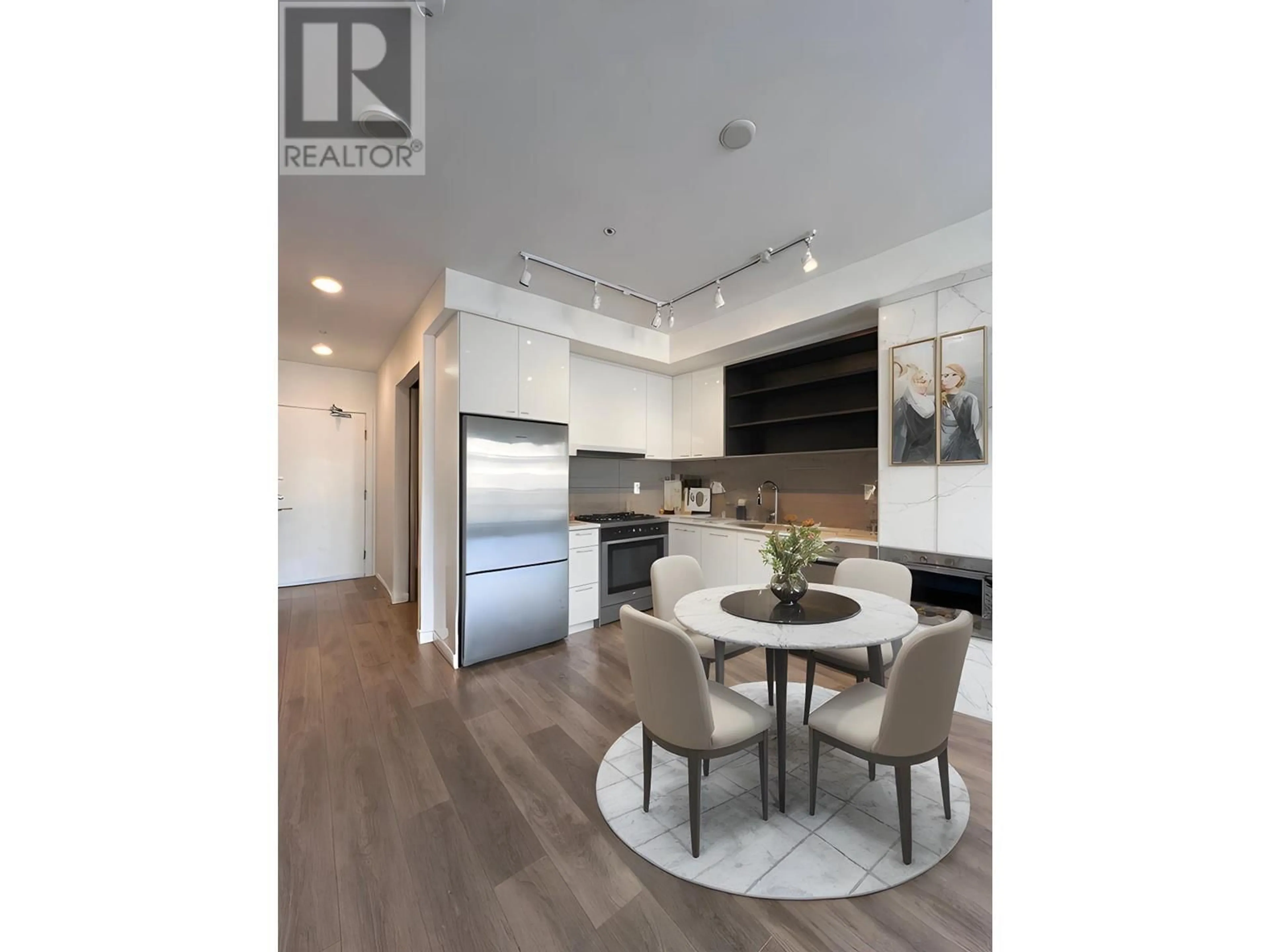 Open concept kitchen, wood/laminate floor for 319 - 725 MARINE DRIVE, North Vancouver British Columbia V7M0G2