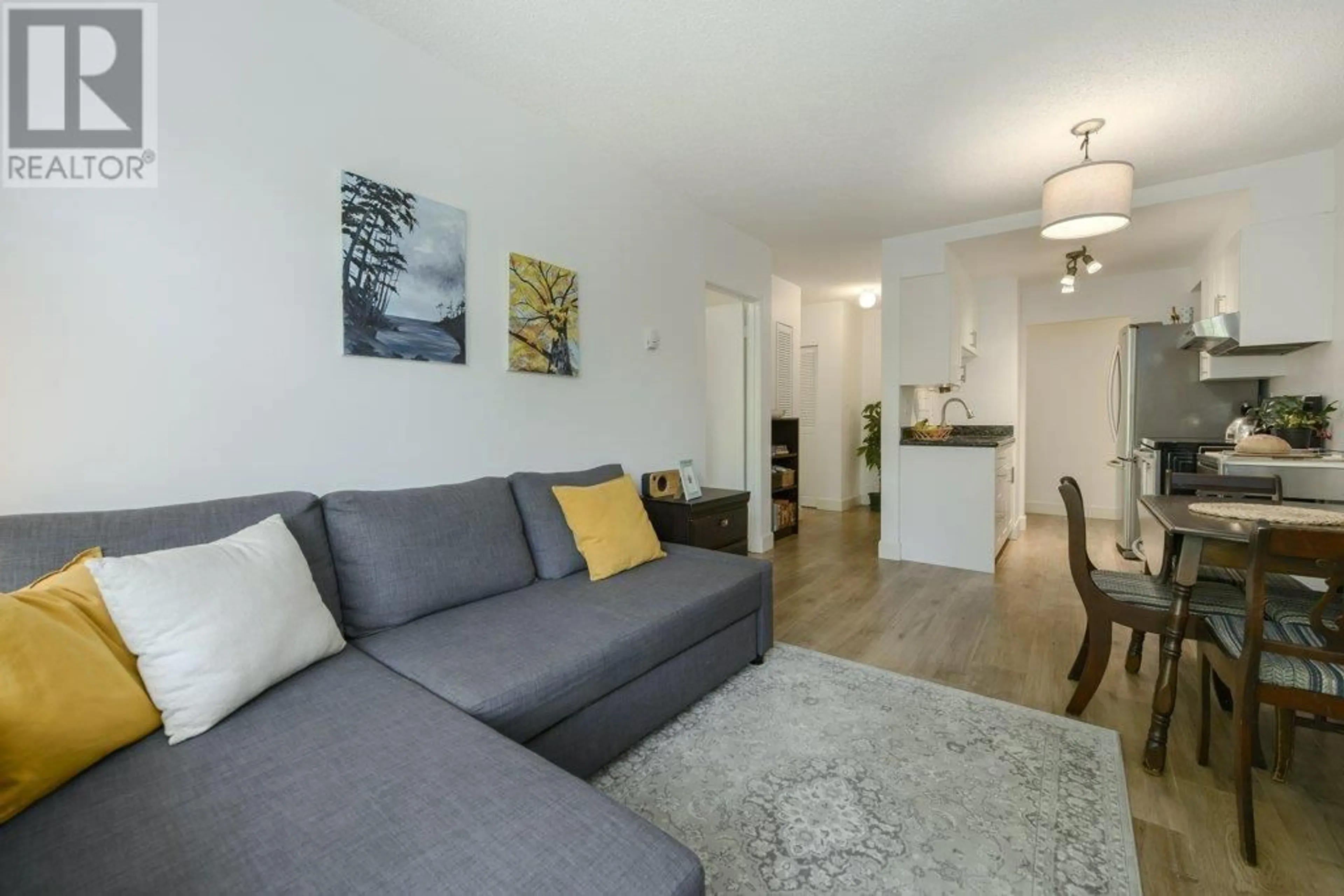 Living room with furniture, wood/laminate floor for 320 - 711 6 AVENUE, Vancouver British Columbia V5T1L7