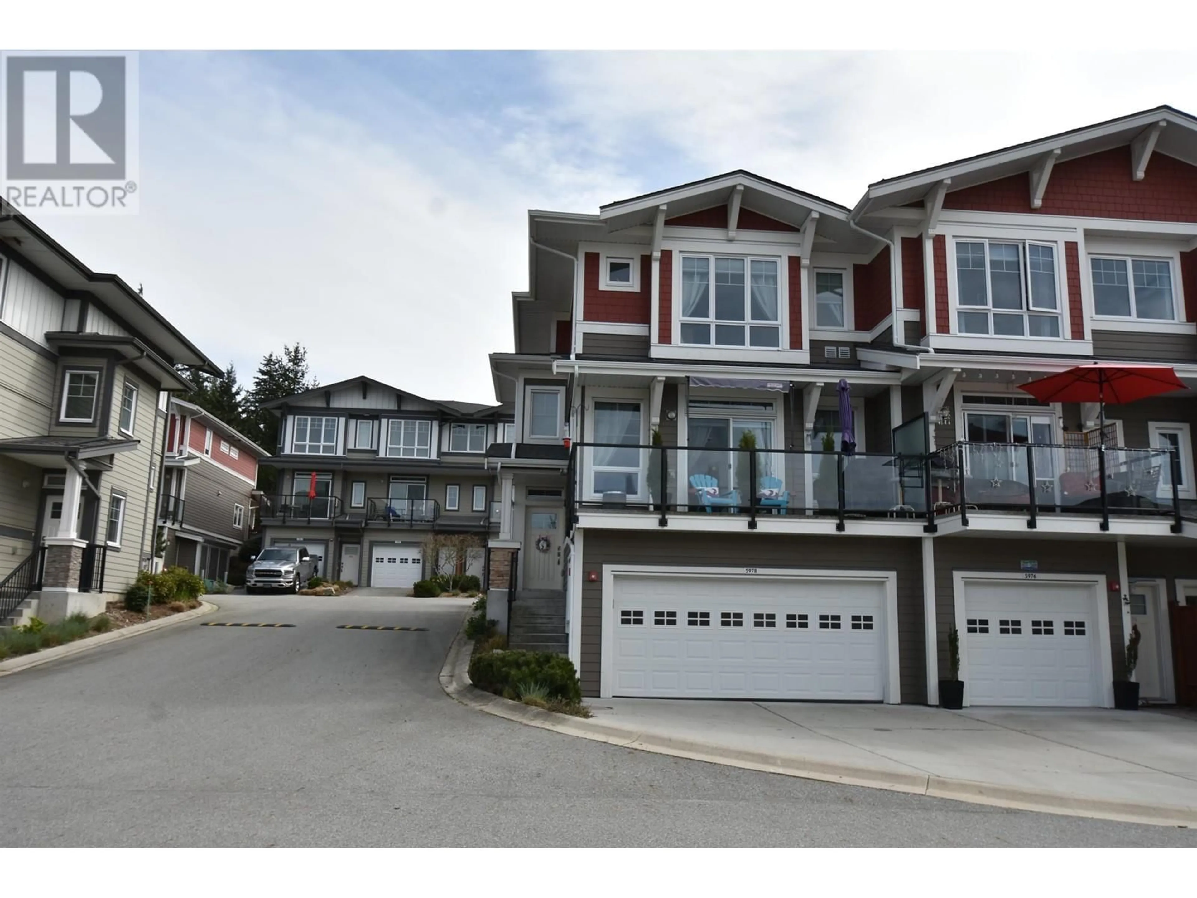 A pic from outside/outdoor area/front of a property/back of a property/a pic from drone, street for 5978 BEACHGATE LANE, Sechelt British Columbia V7Z0S2