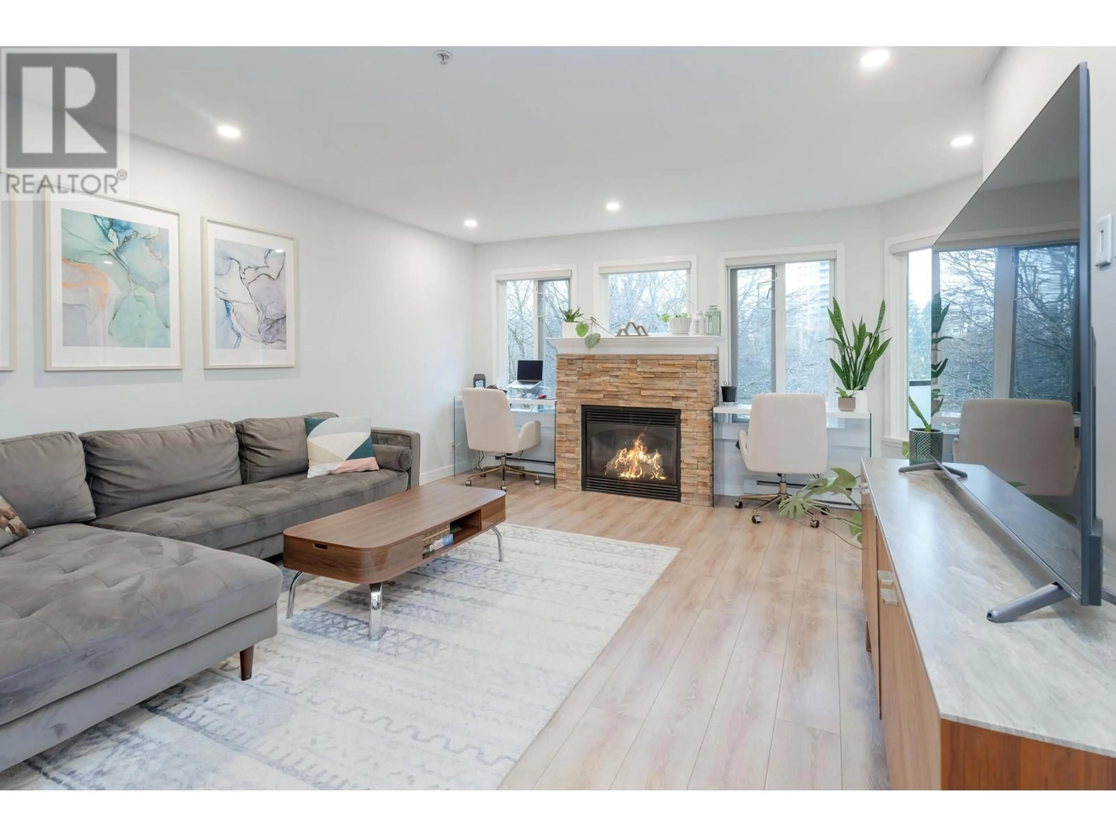 Living room with furniture, wood/laminate floor for 301 - 7139 18 AVENUE, Burnaby British Columbia V3N4Z3