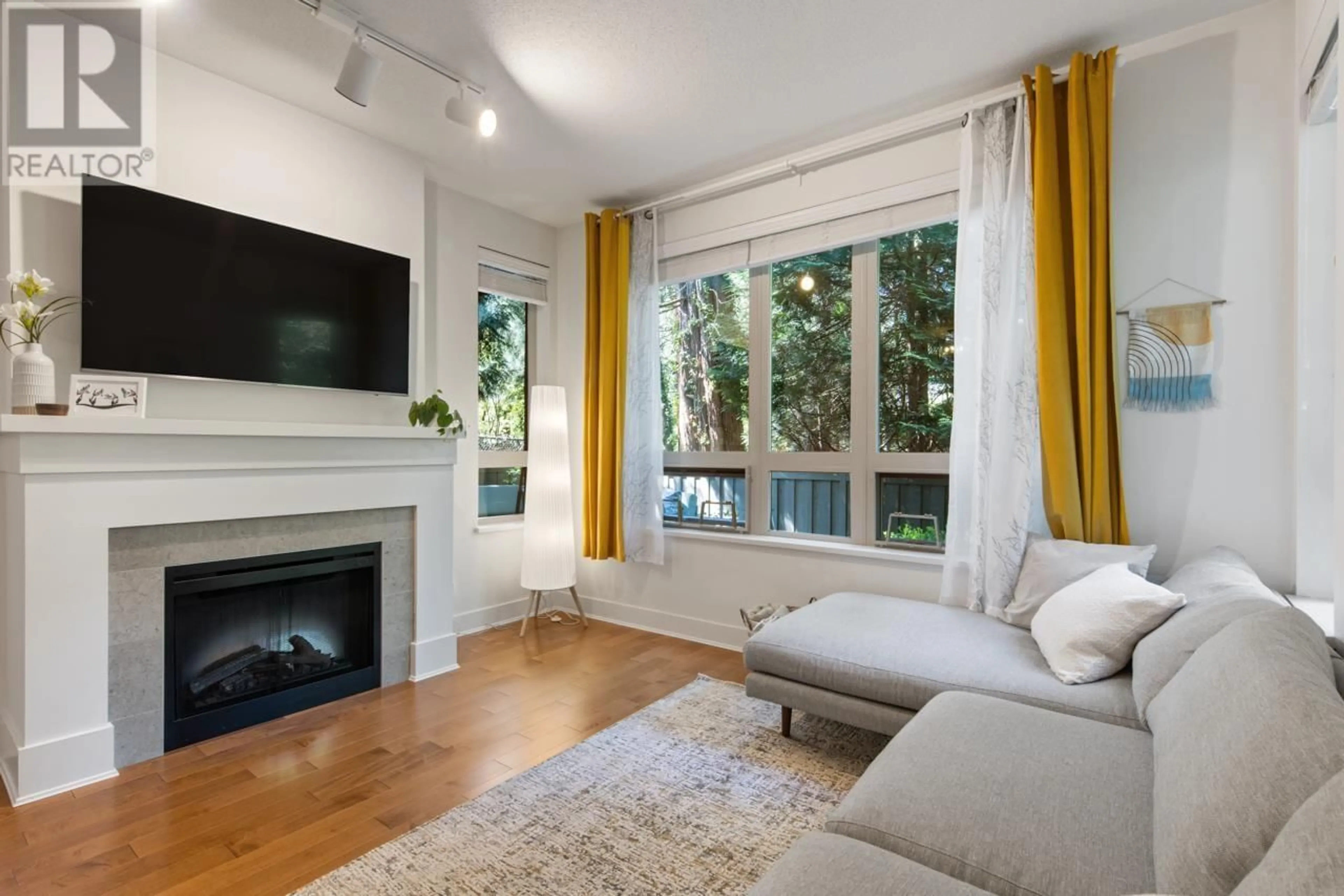 Living room with furniture, wood/laminate floor for 111 - 1111 27TH STREET, North Vancouver British Columbia V7J1S3
