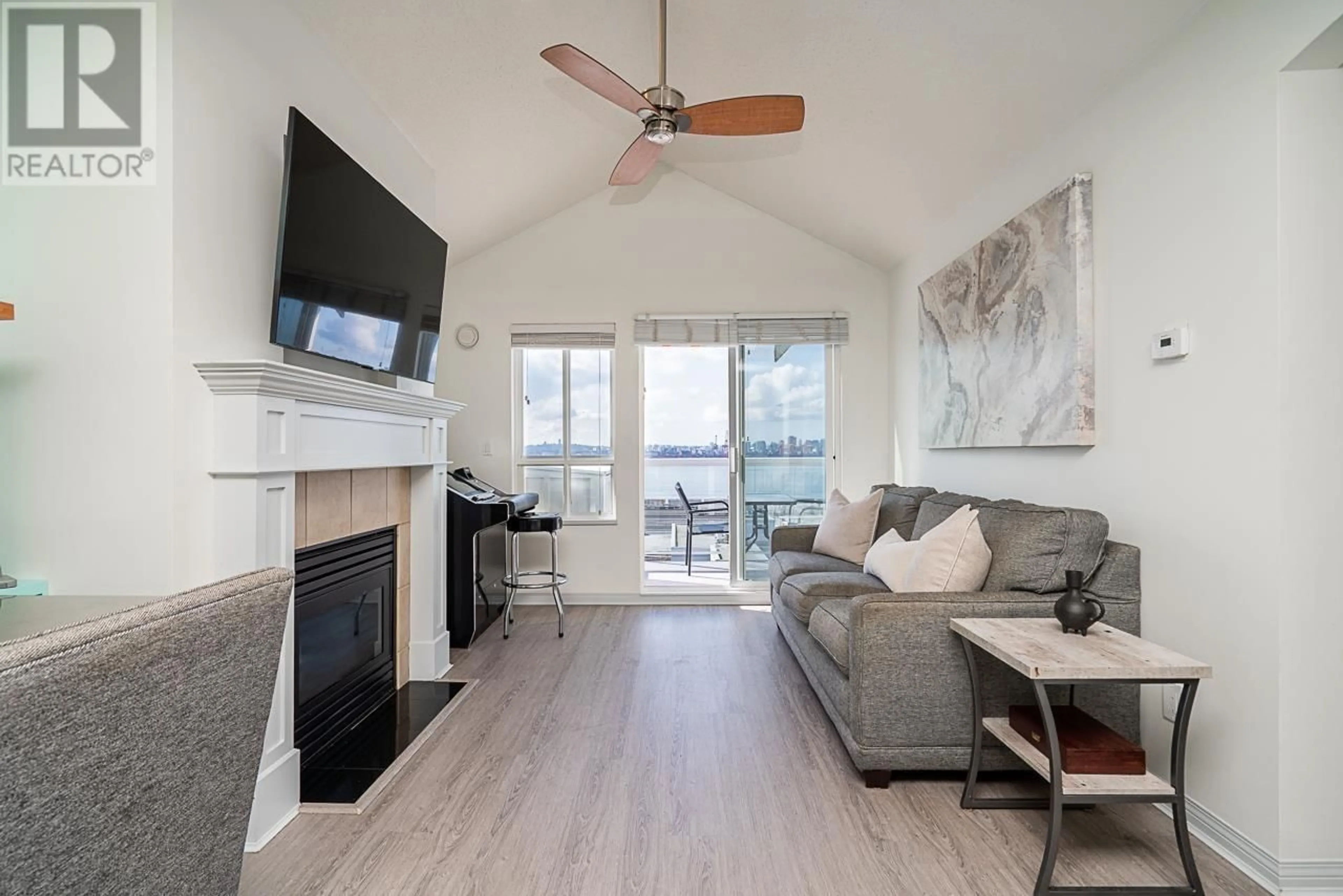 Living room with furniture, wood/laminate floor for 409 - 365 1ST STREET, North Vancouver British Columbia V7L4W5