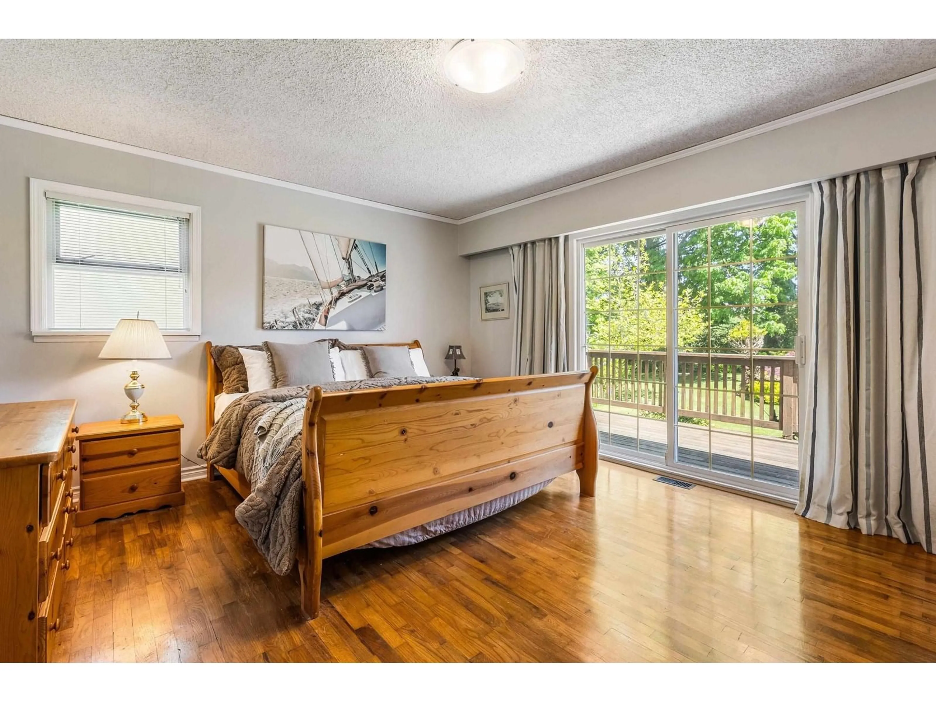 Bedroom with bed, wood/laminate floor for 10760 MCDONALD ROAD, Chilliwack British Columbia V2P7L6