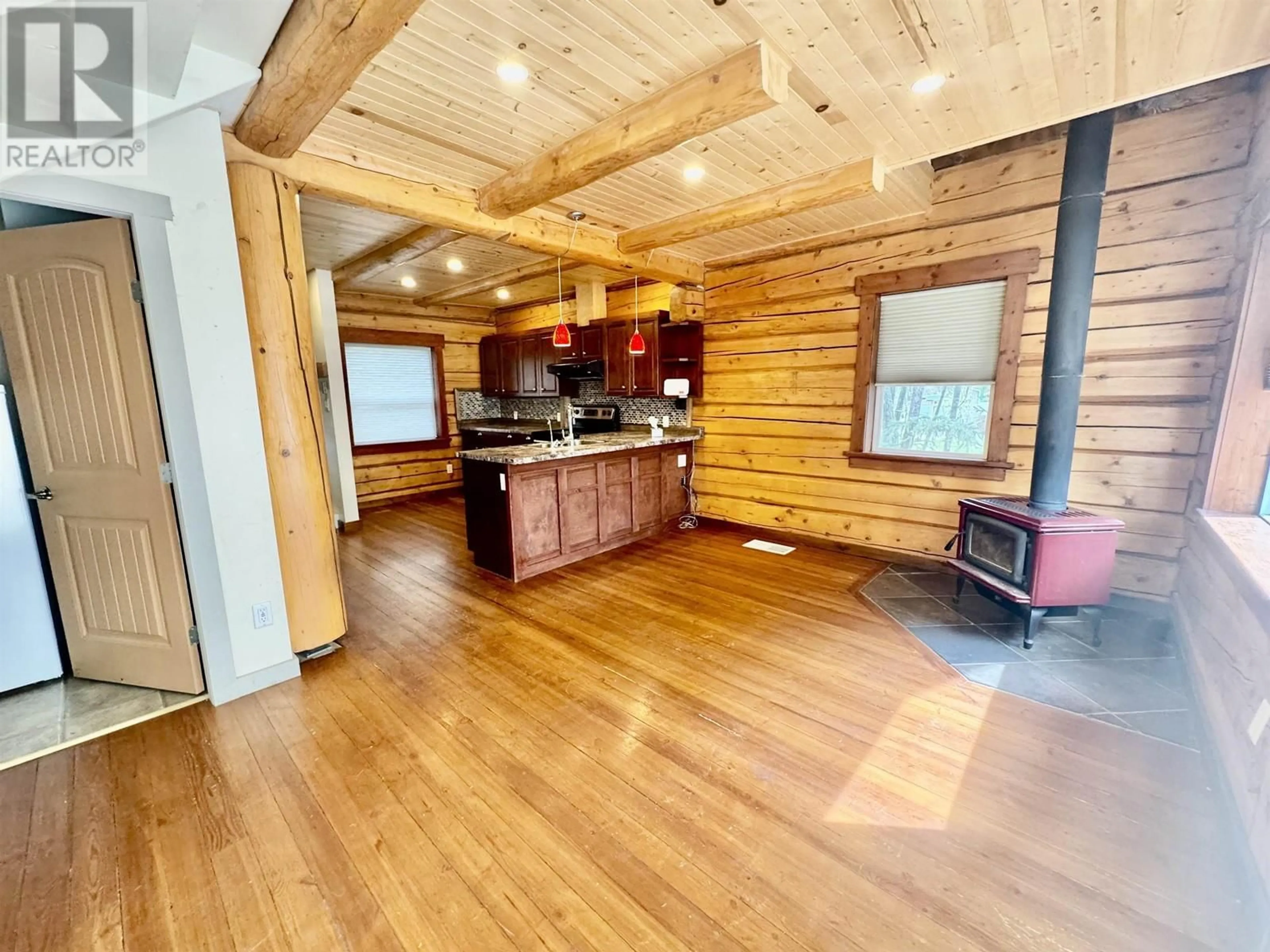 Open concept kitchen, wood/laminate floor for 4086 LAC LA HACHE STATION ROAD, Lac La Hache British Columbia V0K1T1