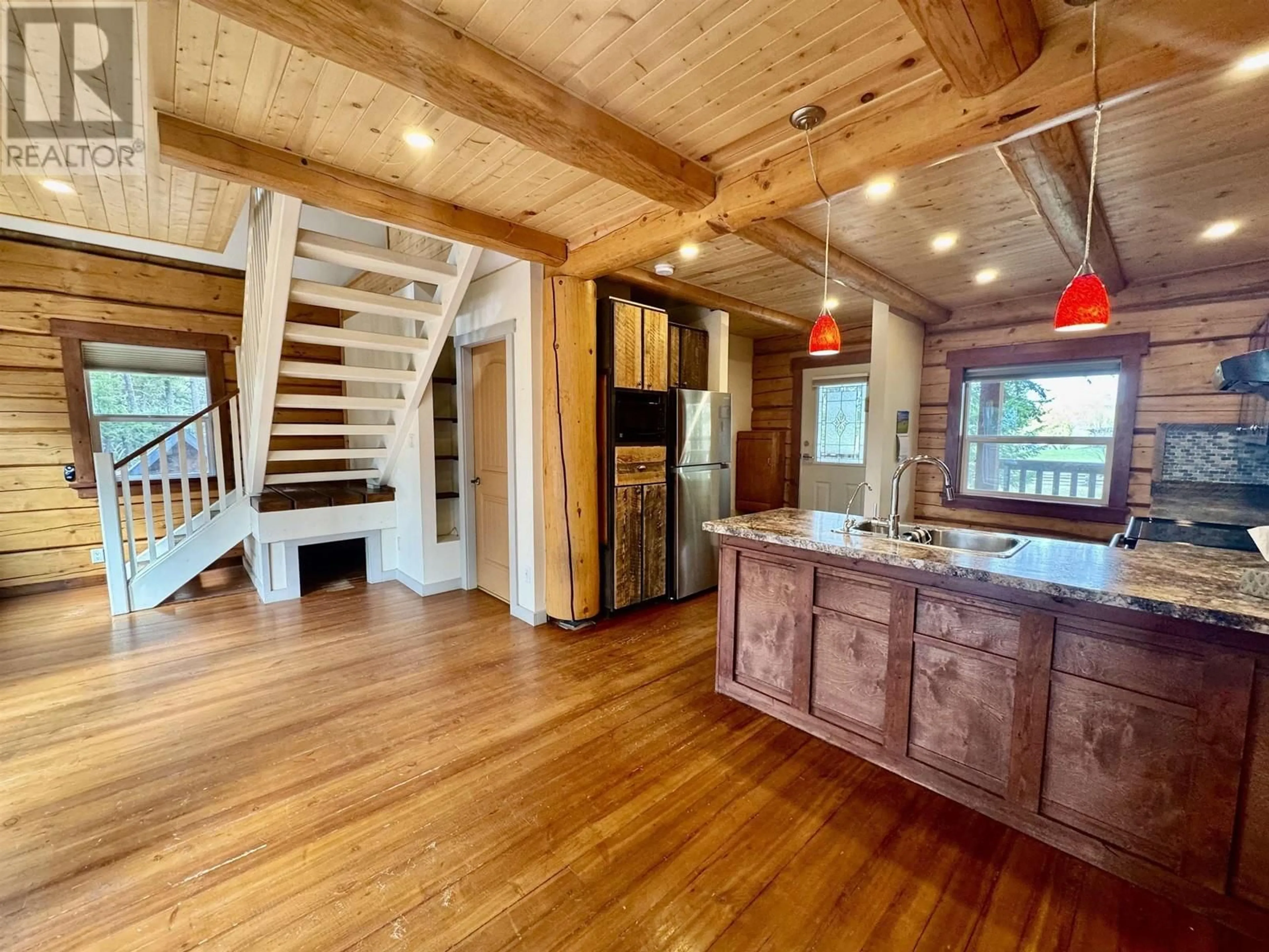 Open concept kitchen, wood/laminate floor for 4086 LAC LA HACHE STATION ROAD, Lac La Hache British Columbia V0K1T1