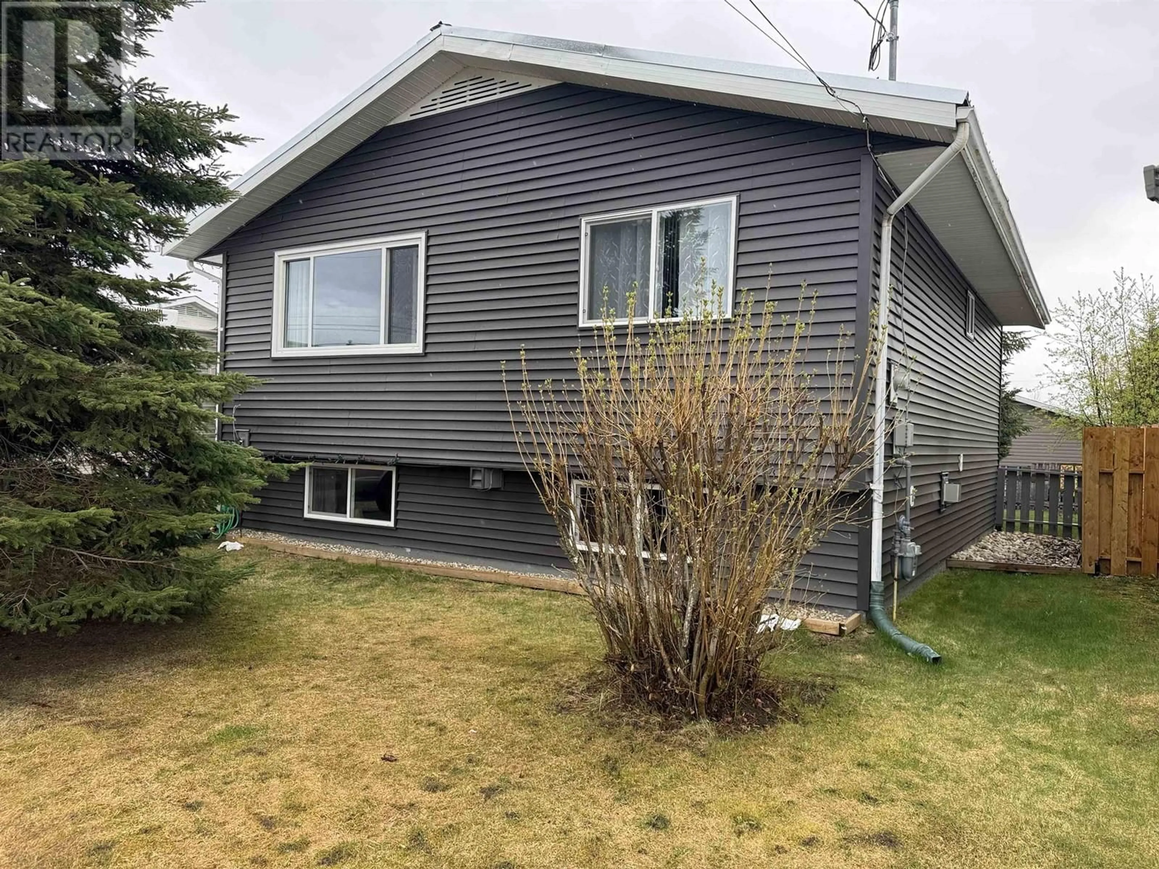 Home with vinyl exterior material, street for 14 MUNRO CRESCENT, Mackenzie British Columbia V0J2C0