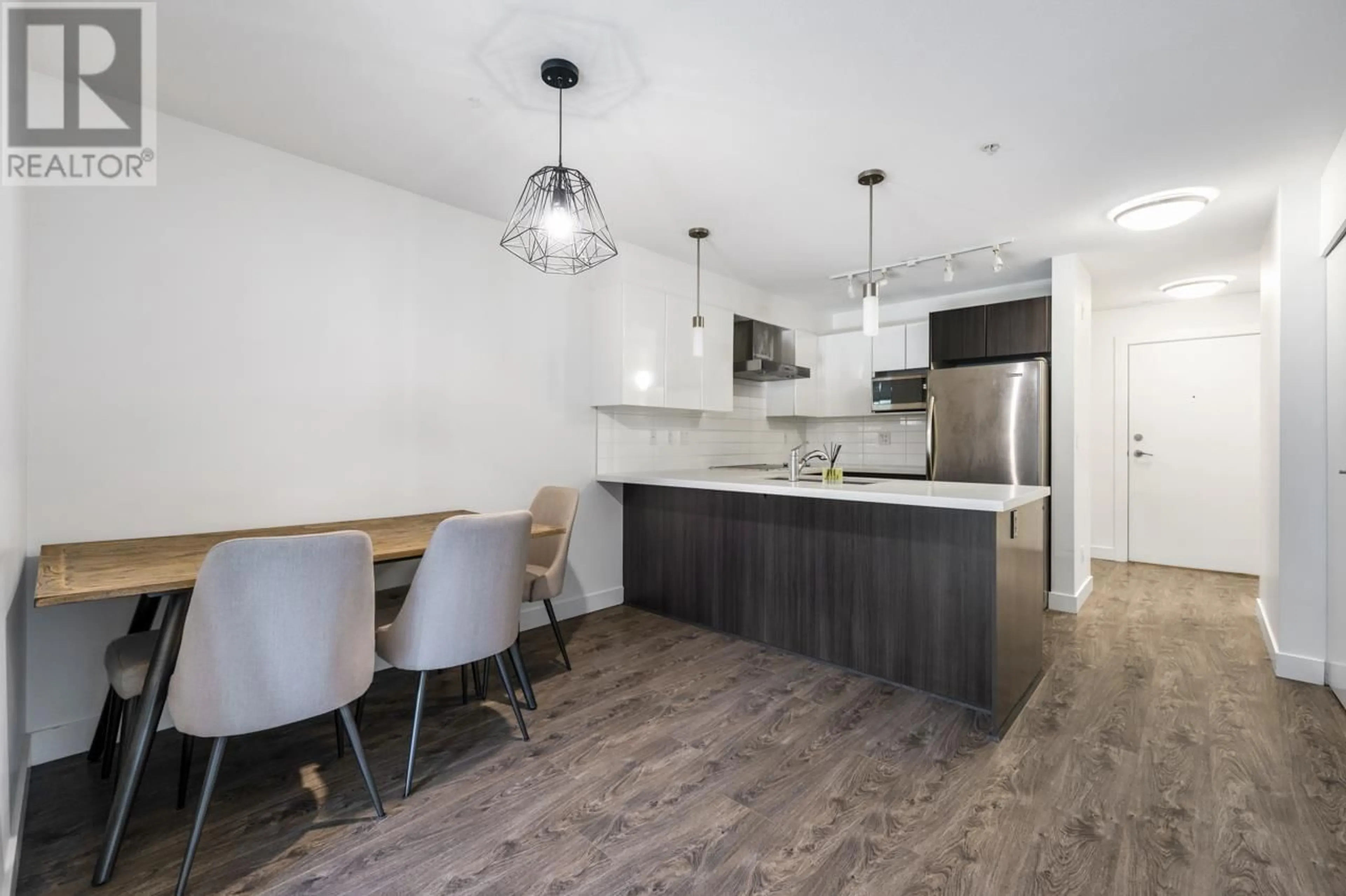 Open concept kitchen, wood/laminate floor for 108 - 7131 STRIDE AVENUE, Burnaby British Columbia V3N0E3