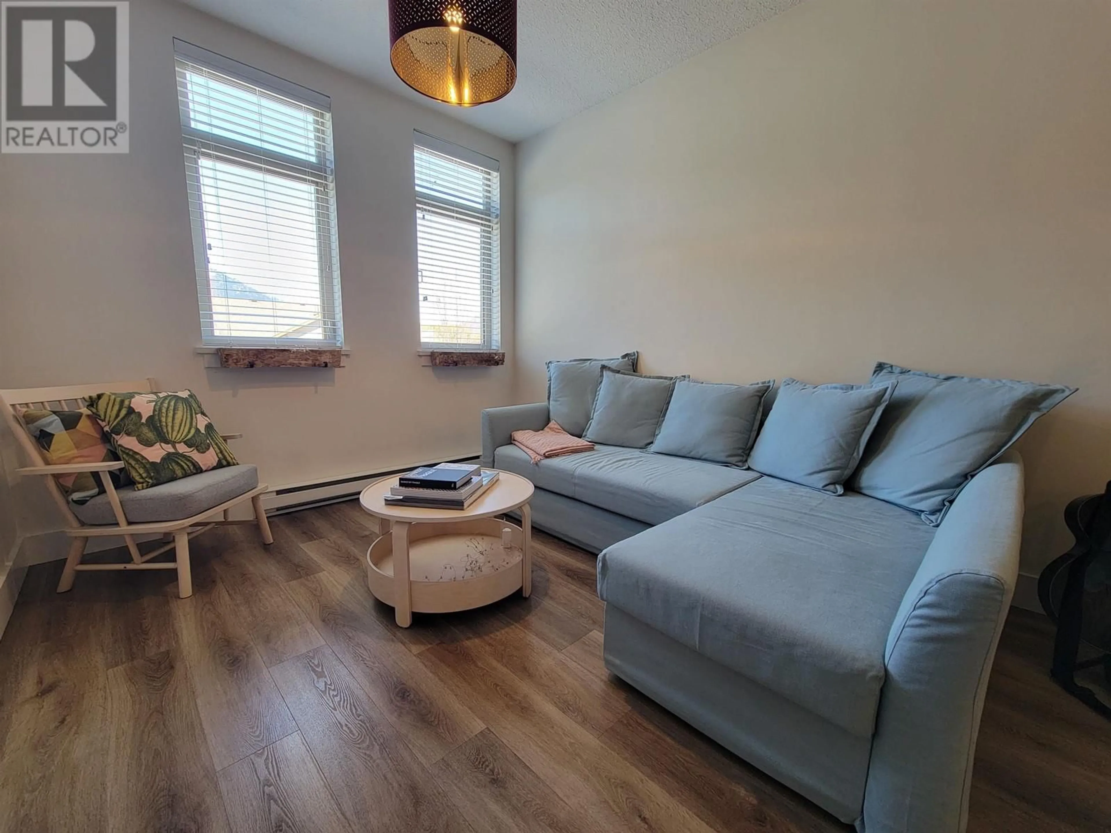 Living room with furniture, wood/laminate floor for 305 - 7330 ARBUTUS STREET, Pemberton British Columbia V0N2L1