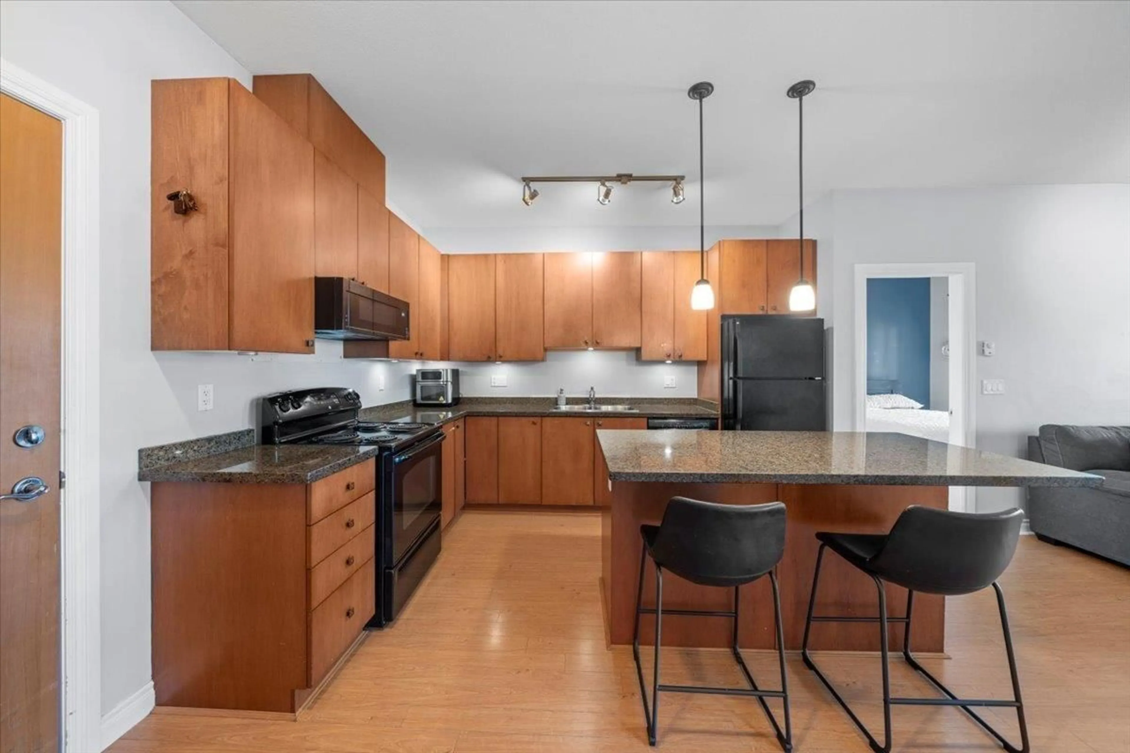 Open concept kitchen, wood/laminate floor for 502 - 8717 160, Surrey British Columbia V4N5X7