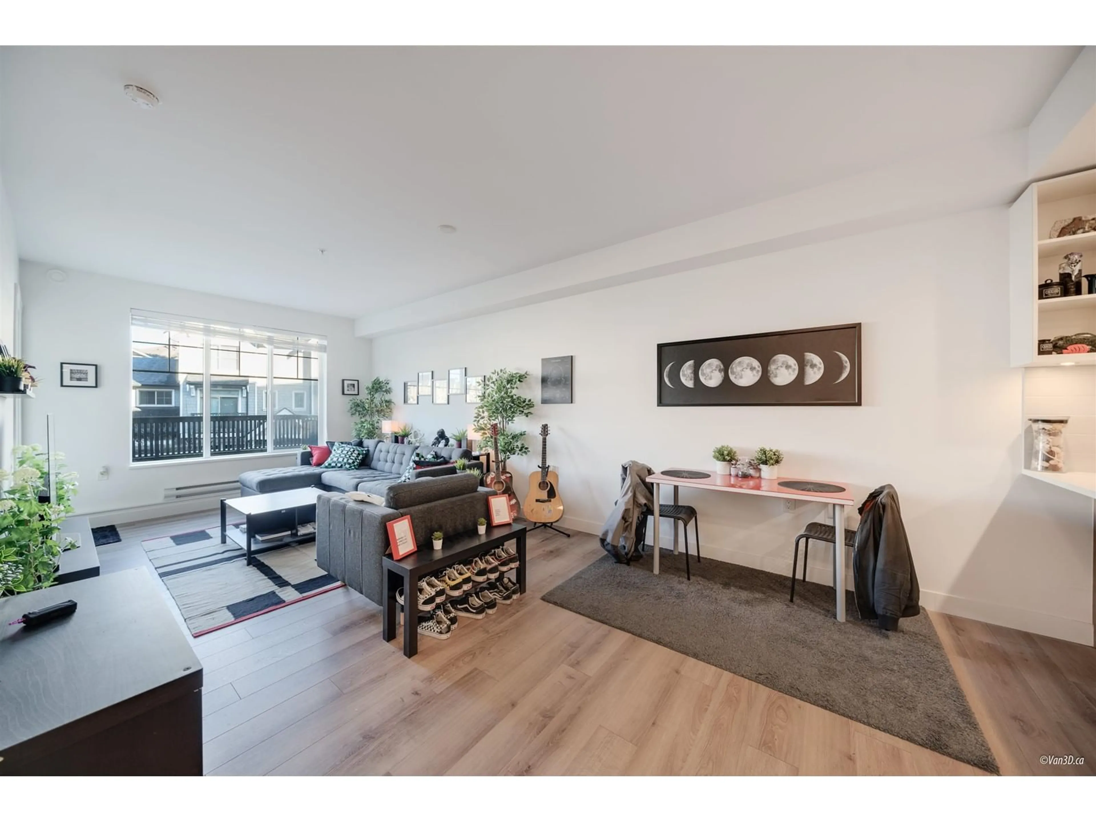 Living room with furniture, wood/laminate floor for B205 - 20487 65, Langley British Columbia V2Y3K5