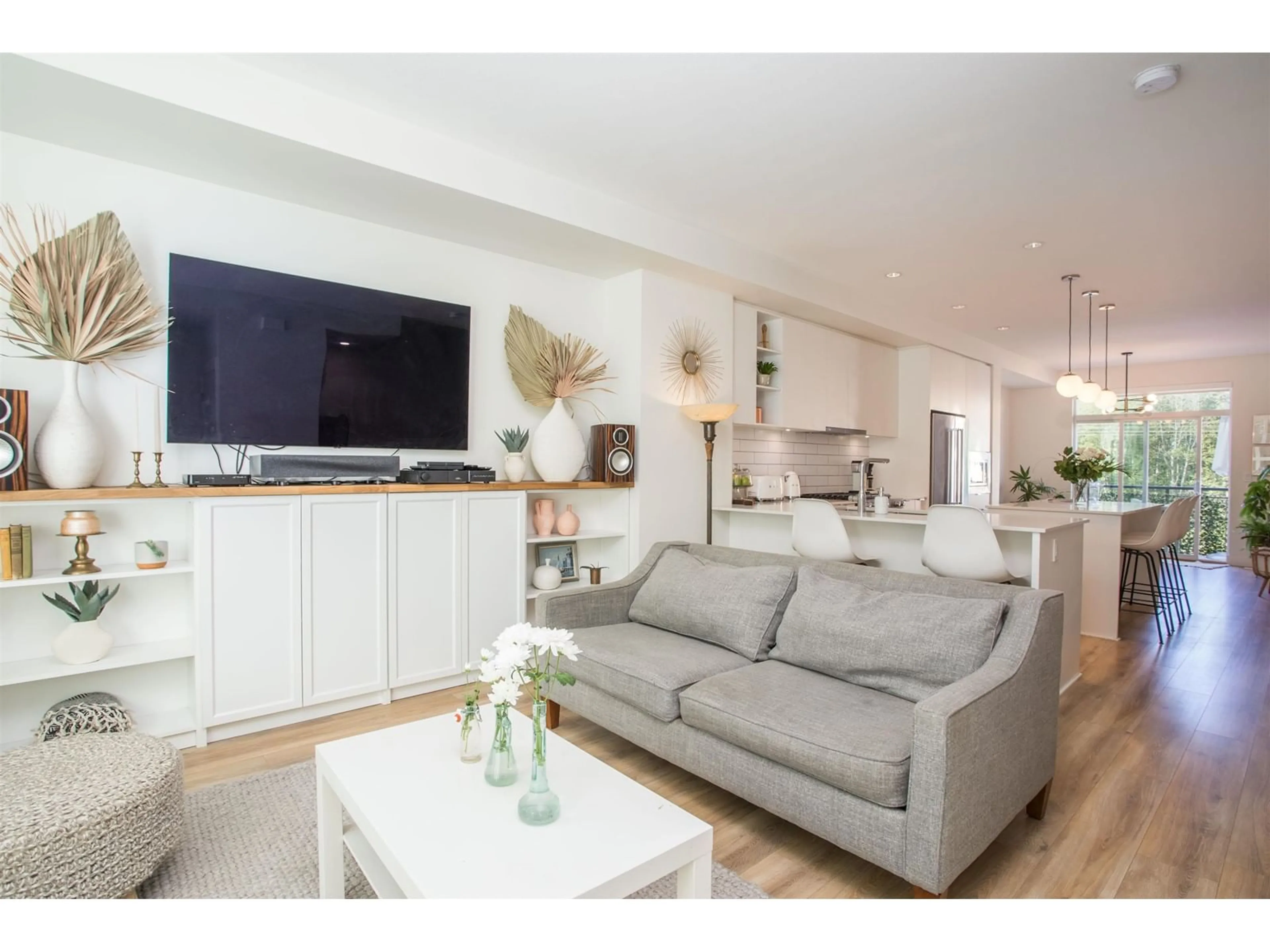 Living room with furniture, wood/laminate floor for 44 - 16561 17A, Surrey British Columbia V3Z1J3