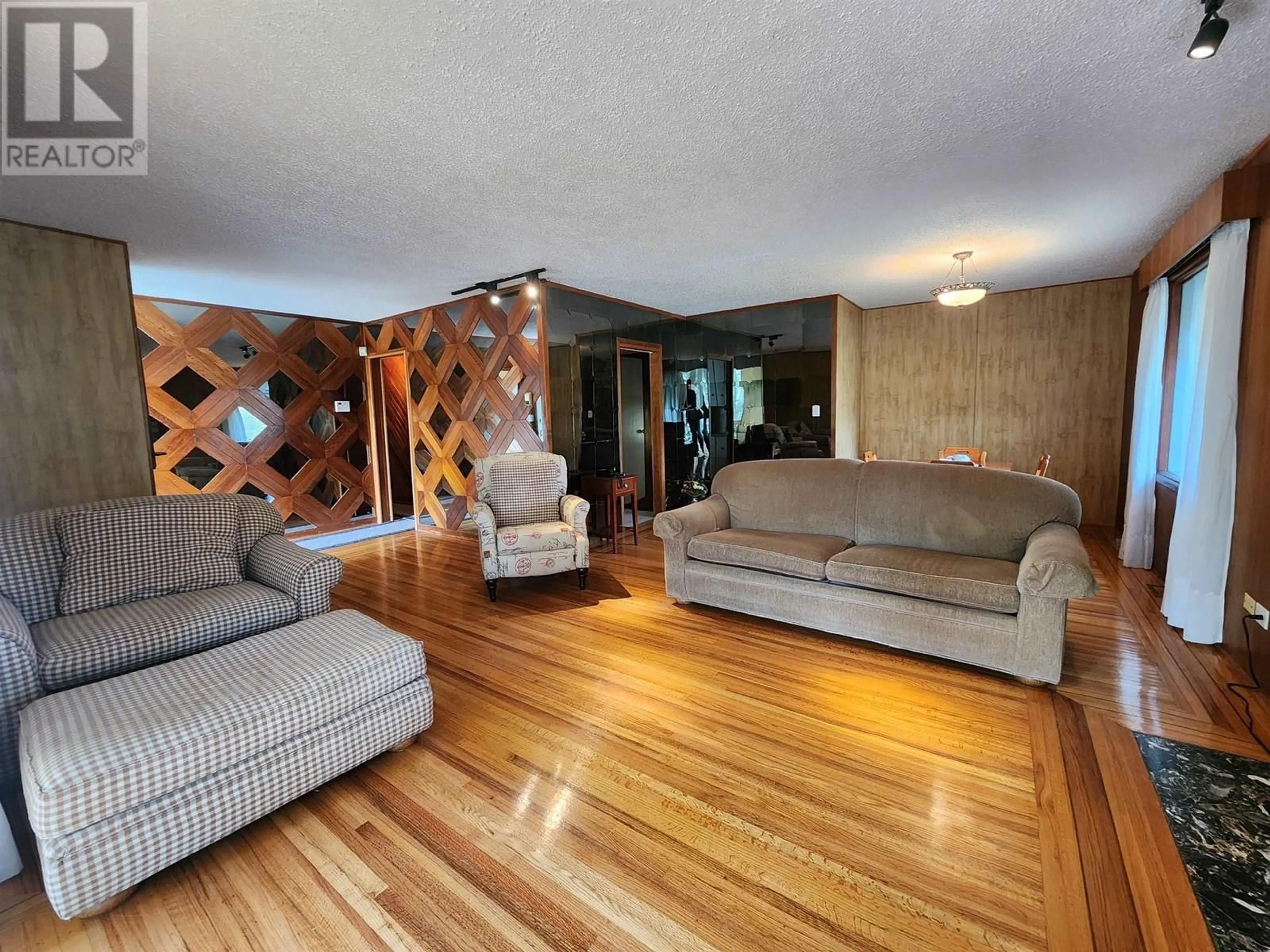 Living room with furniture, wood/laminate floor for 1591 CEDAR STREET, Prince George British Columbia V2L1B6