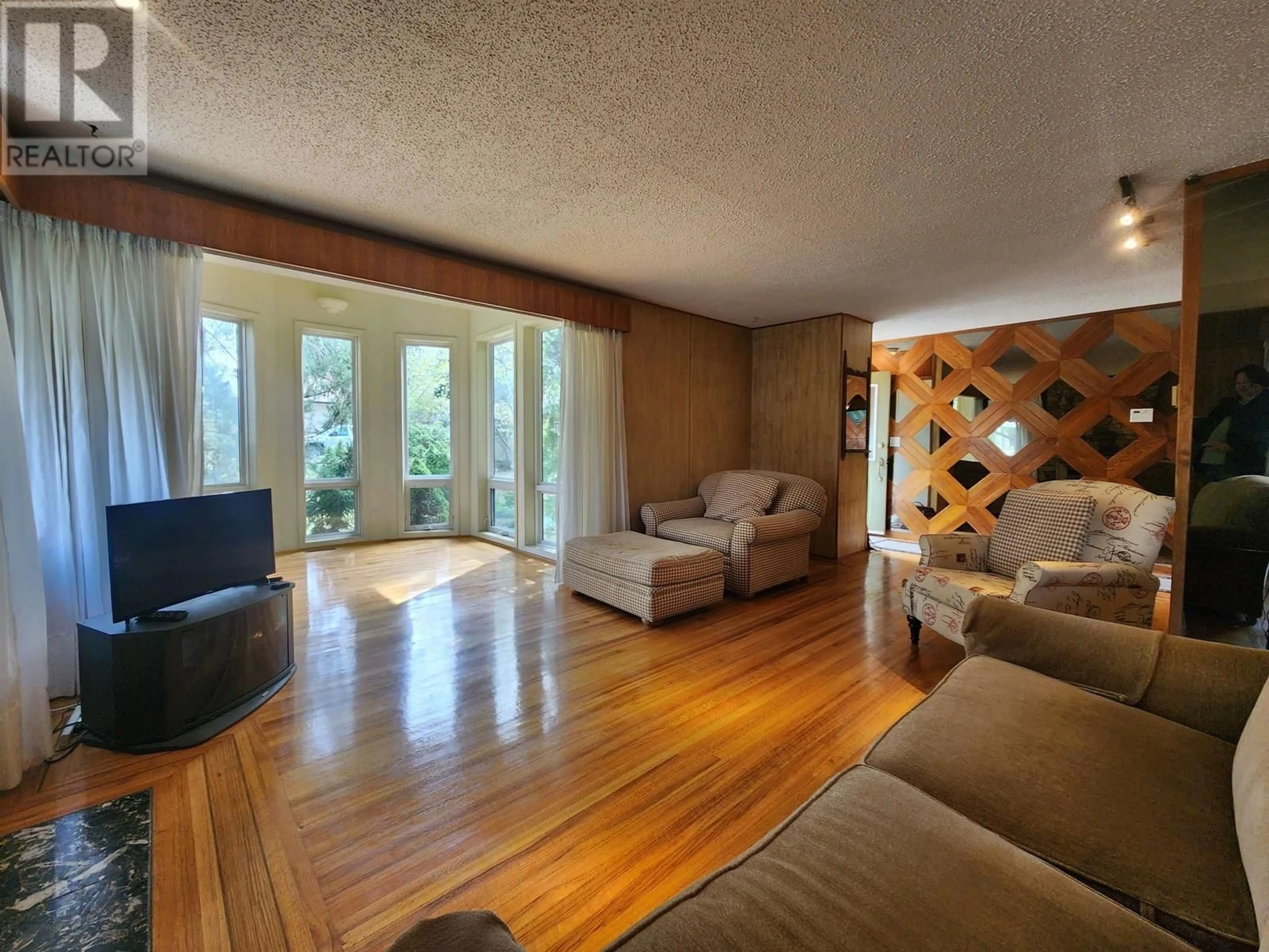 Living room with furniture, wood/laminate floor for 1591 CEDAR STREET, Prince George British Columbia V2L1B6
