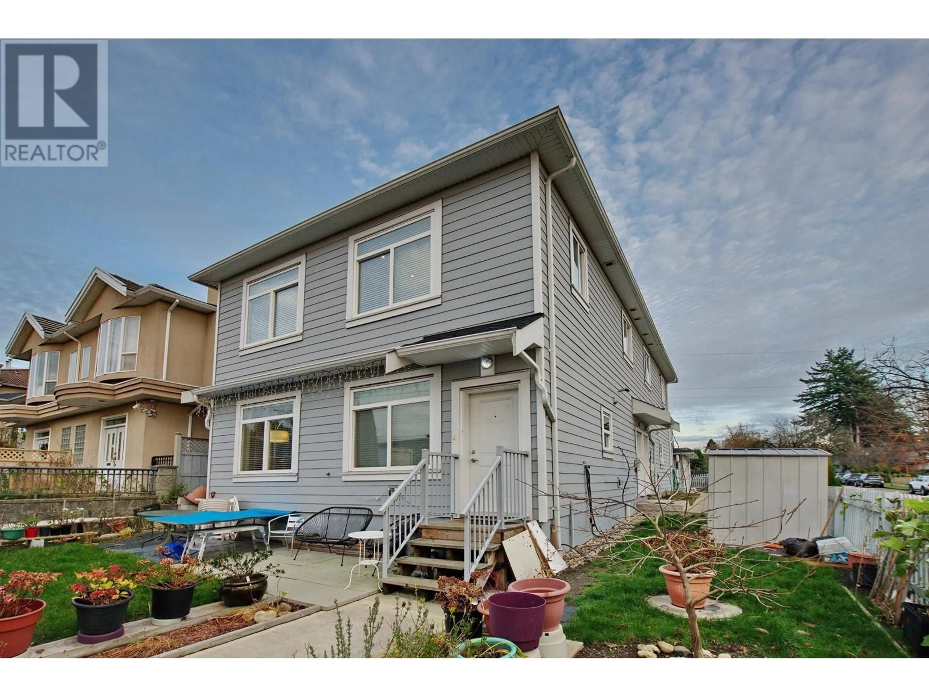Home with vinyl exterior material, street for 213 64 AVENUE, Vancouver British Columbia V5X2M5