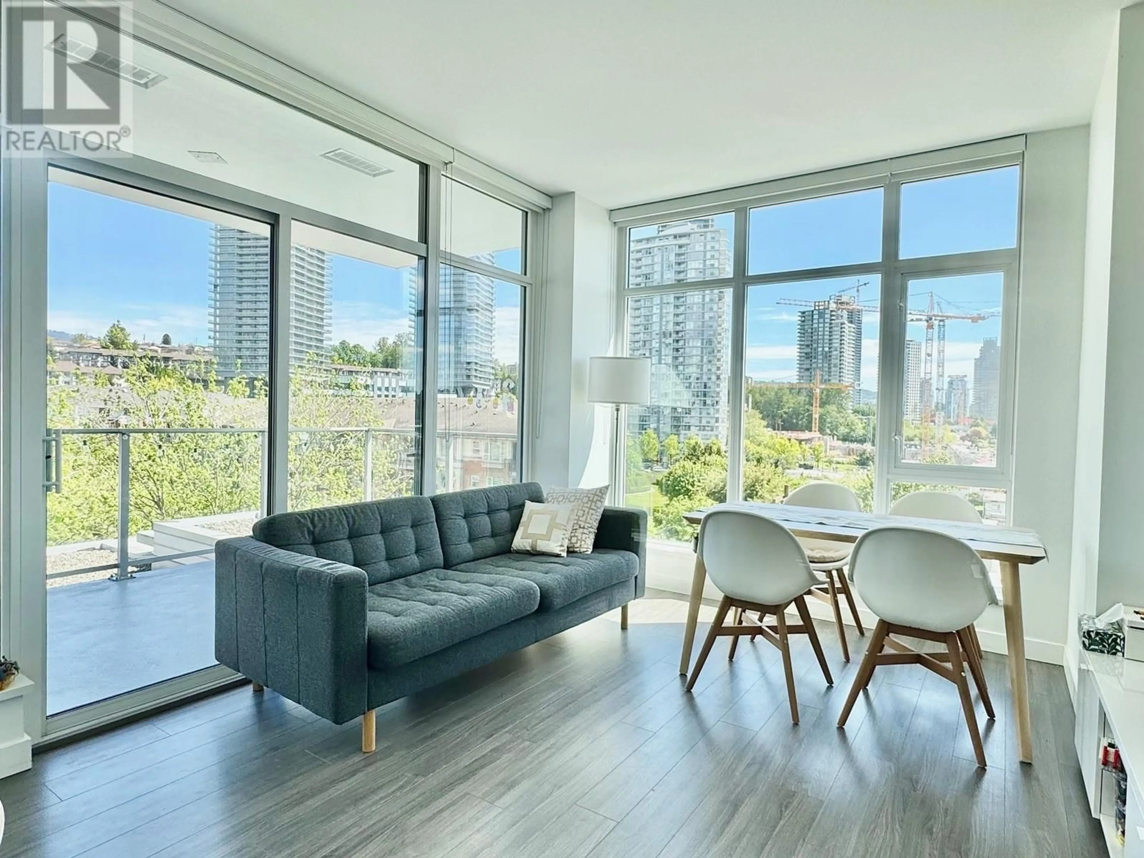 Living room with furniture, wood/laminate floor for 504 - 2351 BETA AVENUE, Burnaby British Columbia V5C0M2