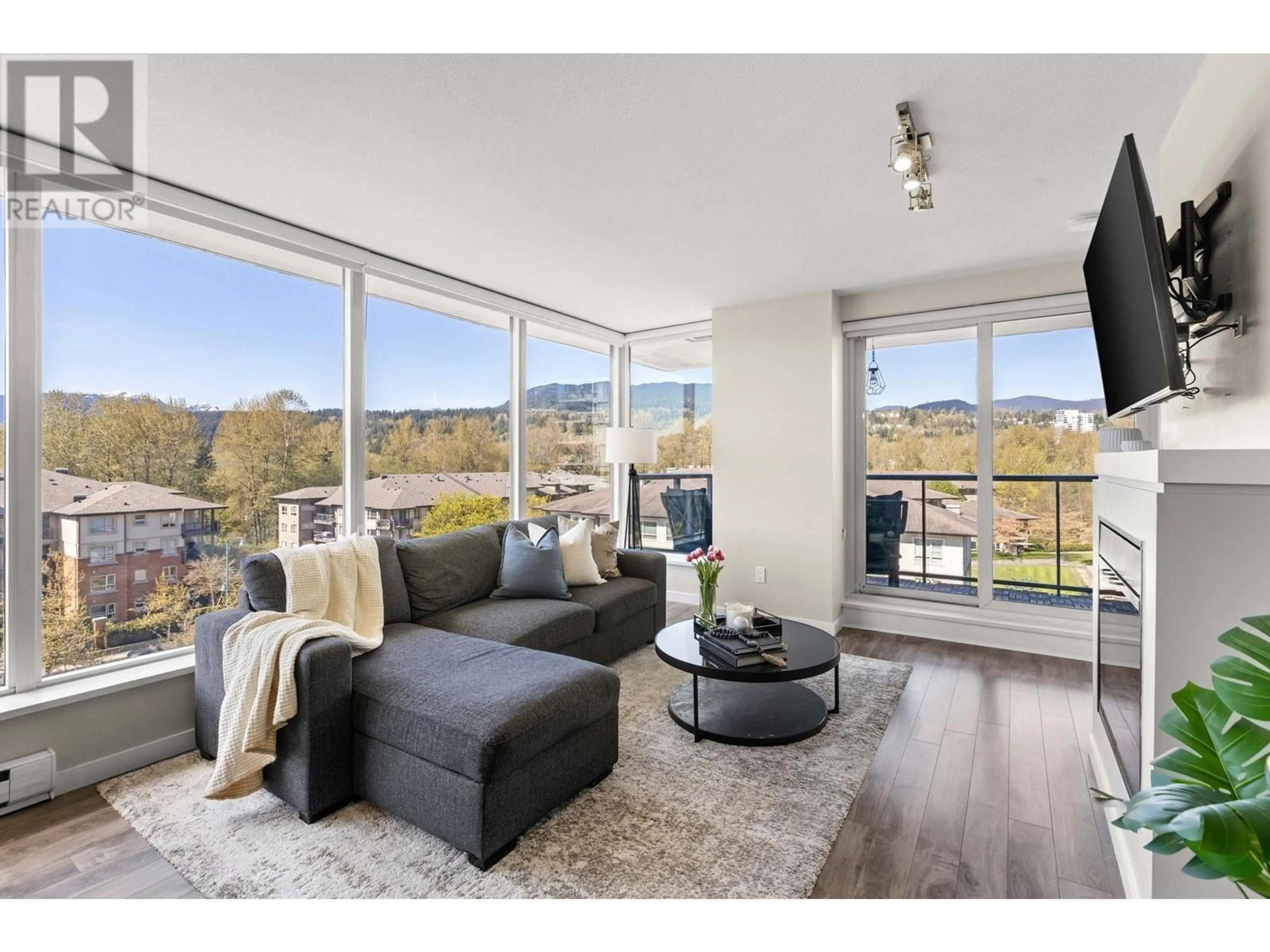 Living room with furniture, wood/laminate floor for 706 - 651 NOOTKA WAY, Port Moody British Columbia V3H0A1