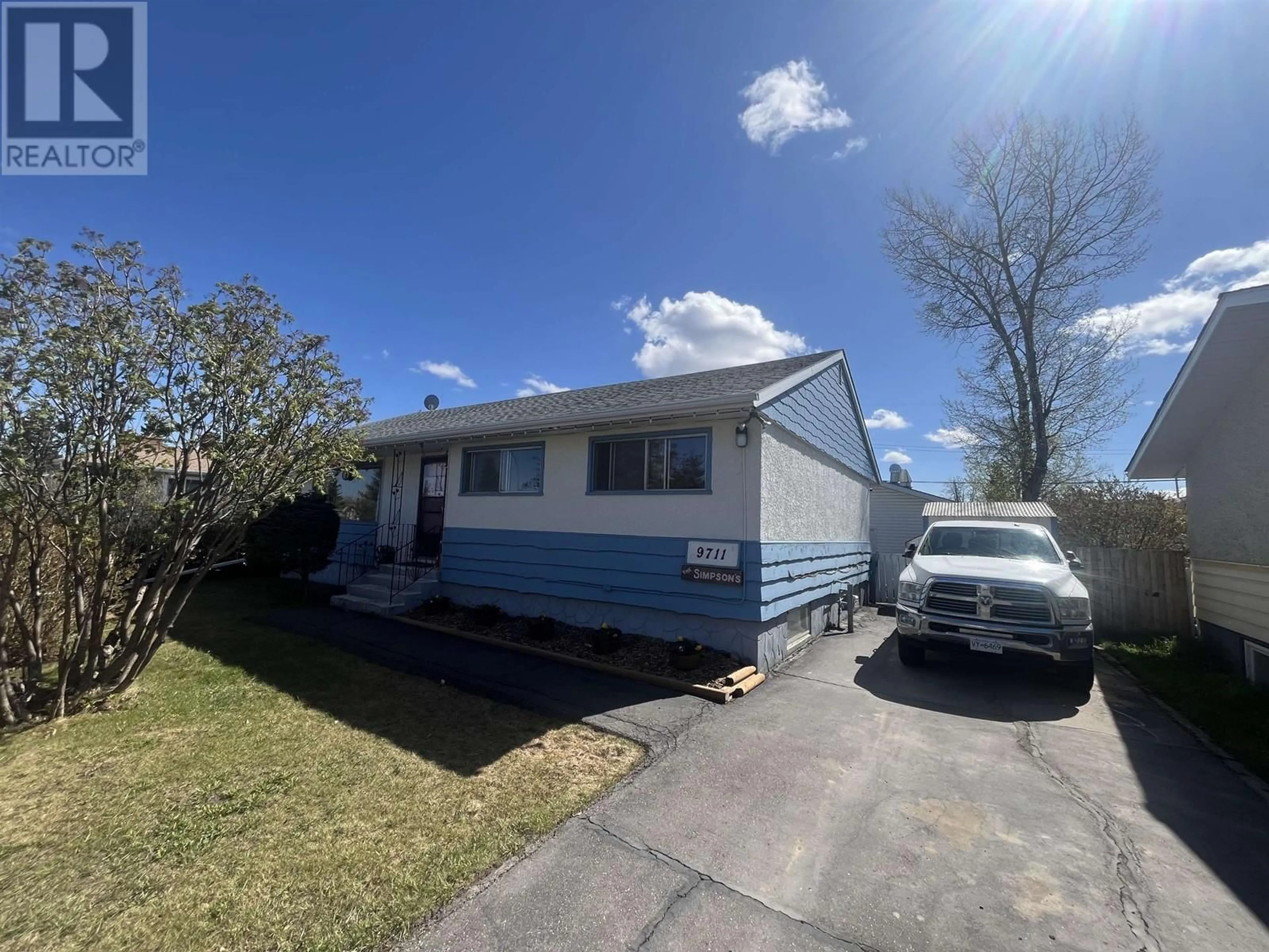 Home with vinyl exterior material, street for 9711 108 AVENUE, Fort St. John British Columbia V1J2P9