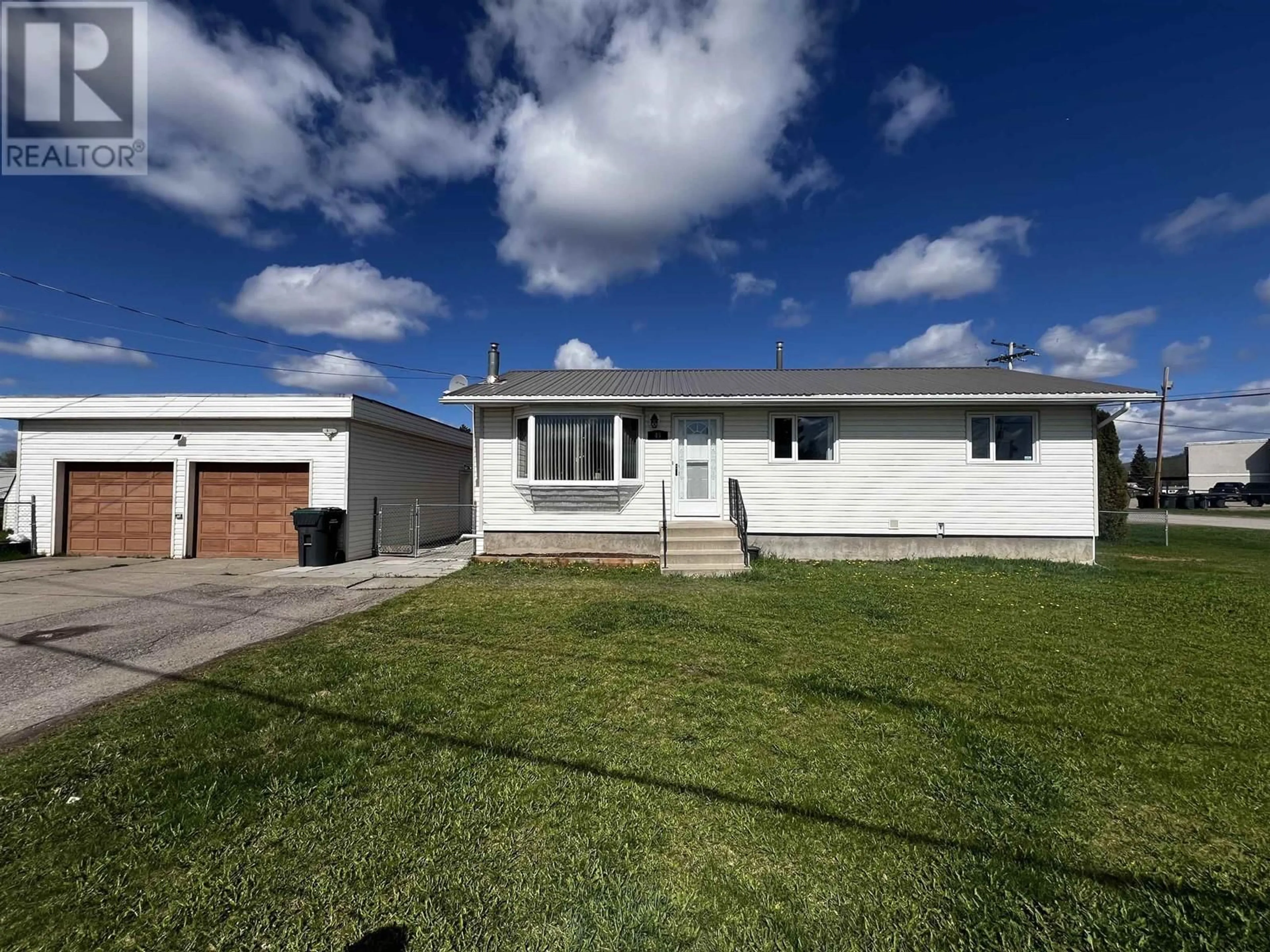 Home with vinyl exterior material, street for 45 TUNASA CRESCENT, Fraser Lake British Columbia V0J1S0