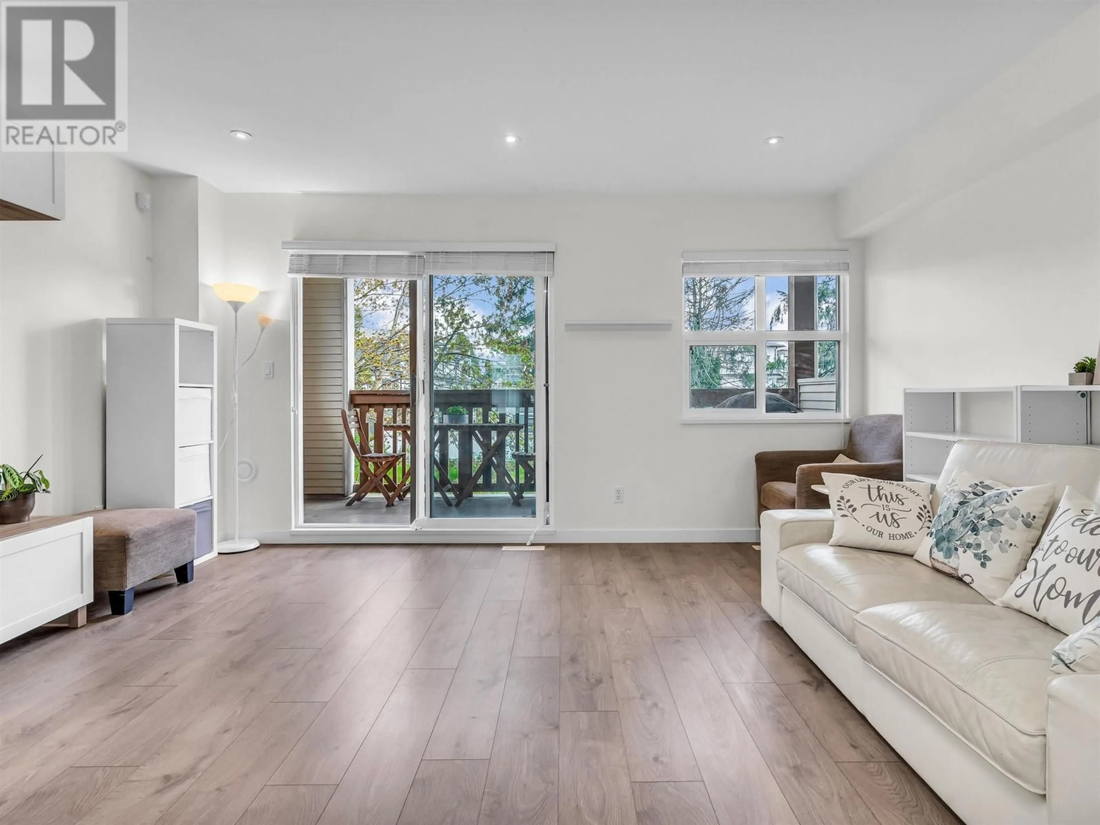 Living room with furniture, wood/laminate floor for 23 - 7100 LYNNWOOD DRIVE, Richmond British Columbia V7C5S8