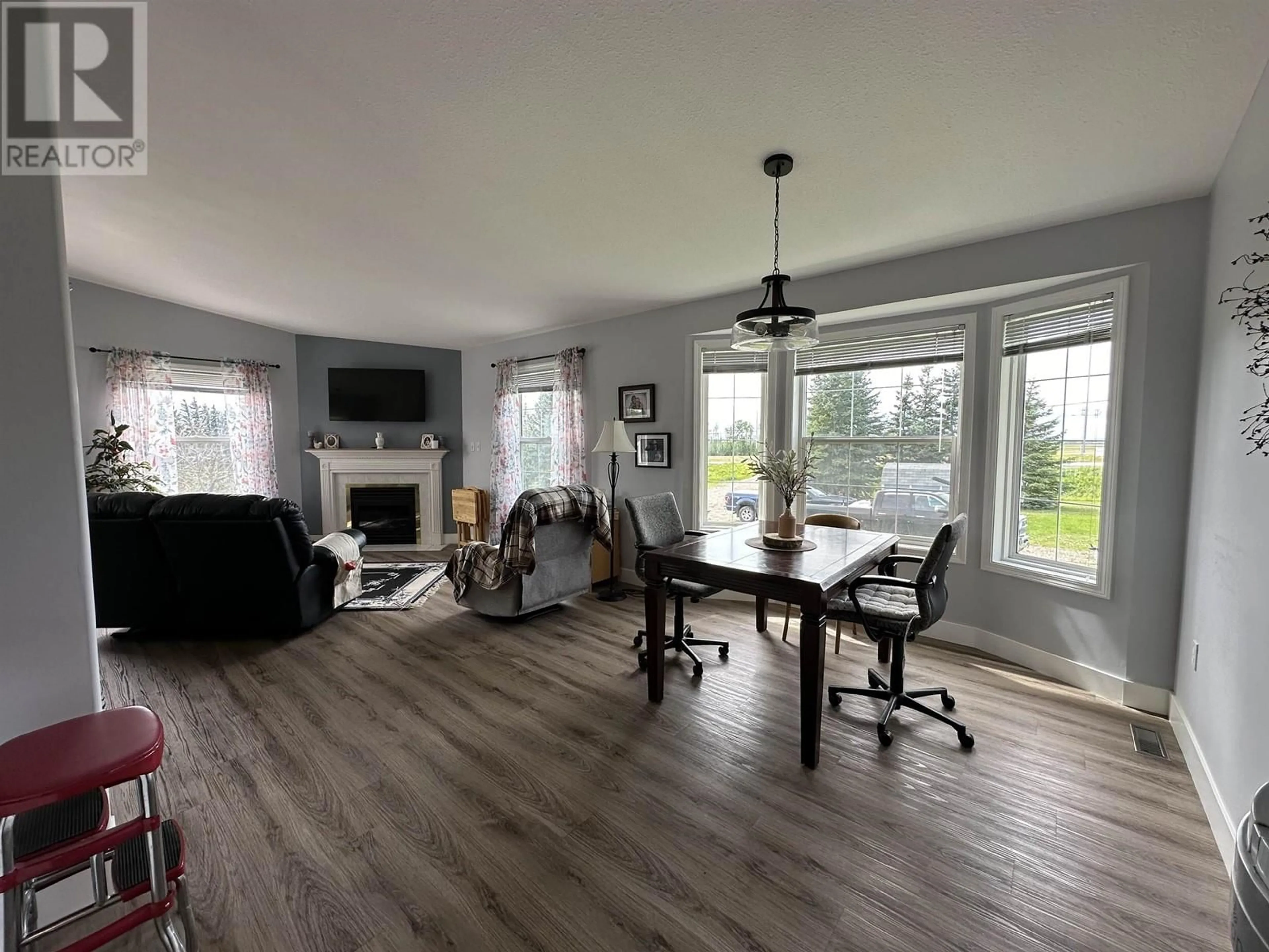 Living room with furniture, wood/laminate floor for 9789 255 ROAD, Fort St. John British Columbia V1J8B9