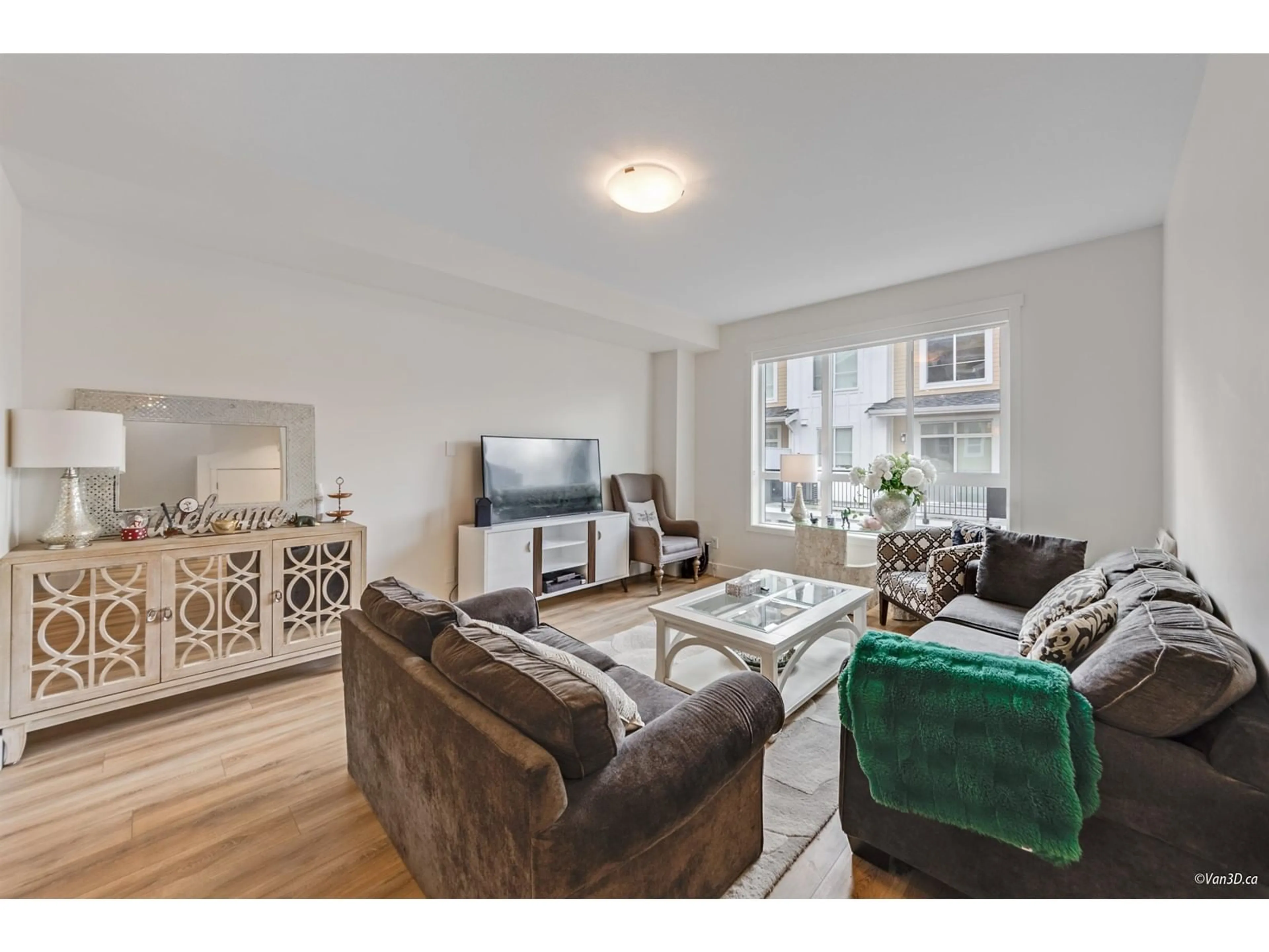 Living room with furniture, wood/laminate floor for 109 - 16561 17A, Surrey British Columbia V3Z1J3